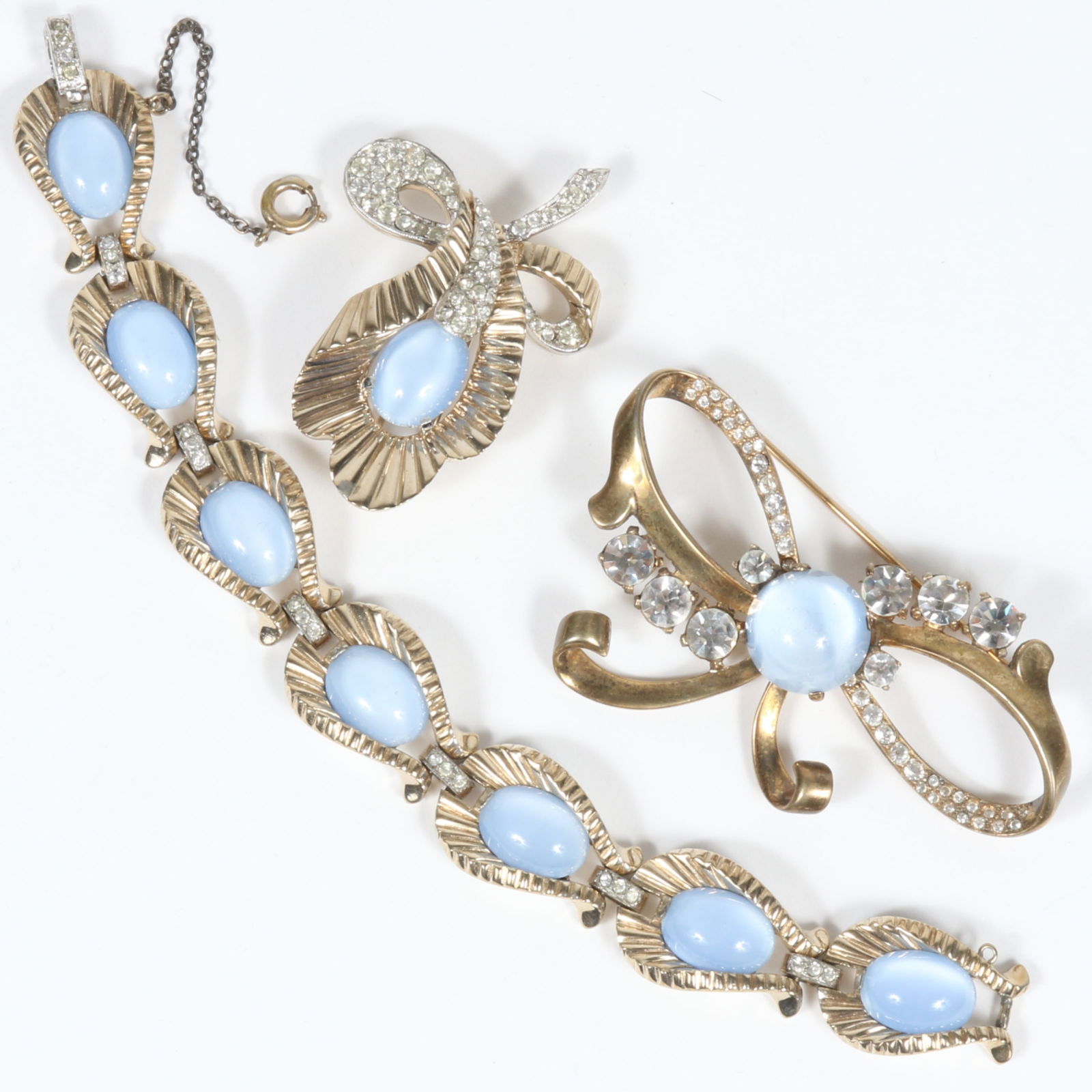 Mazer Bros bow brooch with ice blue moonstone cabochon and rhinestone accents and Jomaz matching (1 of 8)