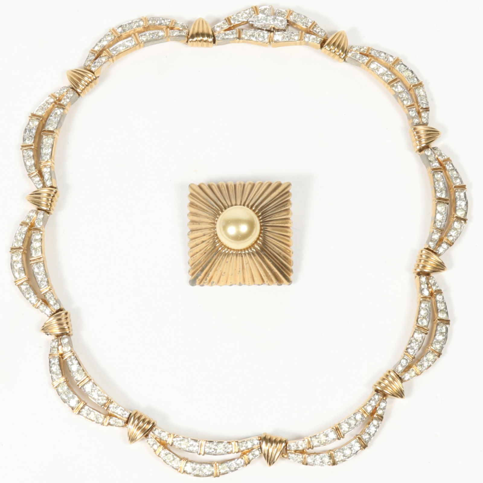 Mazer dimensional square brooch with faux pearl center and Jomaz gold tone diamante rhinestone: Mazer dimensional square brooch with faux pearl center and Jomaz gold tone diamante rhinestone crystal necklace. Both have minor loss of gold finish. From the private collection of Leigh Leshner, auth
