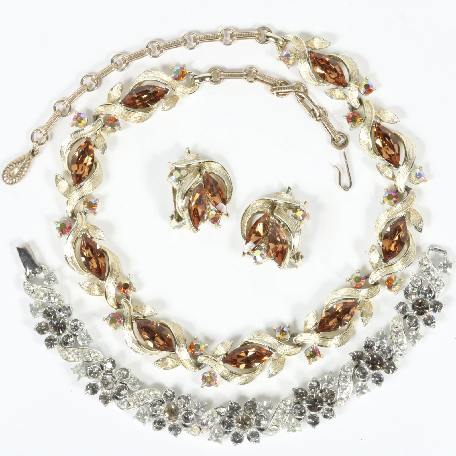 Vintage Lisner 3pc group: citrine and aurora borealis rhinestone crystal leaf necklace and matching: Vintage Lisner 3pc group: citrine and aurora borealis rhinestone crystal leaf necklace and matching earrings with grey and clear diamante rhinestone bracelet. Bracelet is missing one rhinestone from t