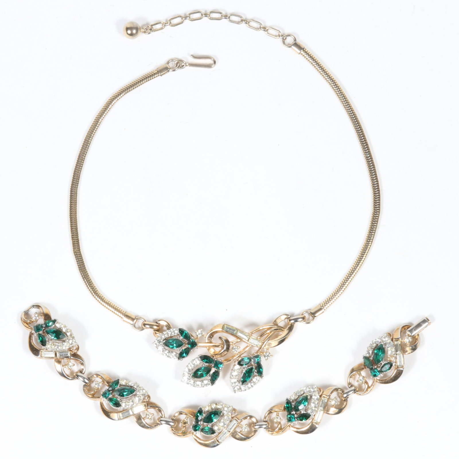 Vintage Retro Crown Trifari foliage necklace with green and clear rhinestone crystals with matching: Vintage Retro Crown Trifari foliage necklace with green and clear rhinestone crystals with matching bracelet. Provenance: From the collection of Cheryl Killmer. 15 5/8"L x 1 1/8"W (necklace)