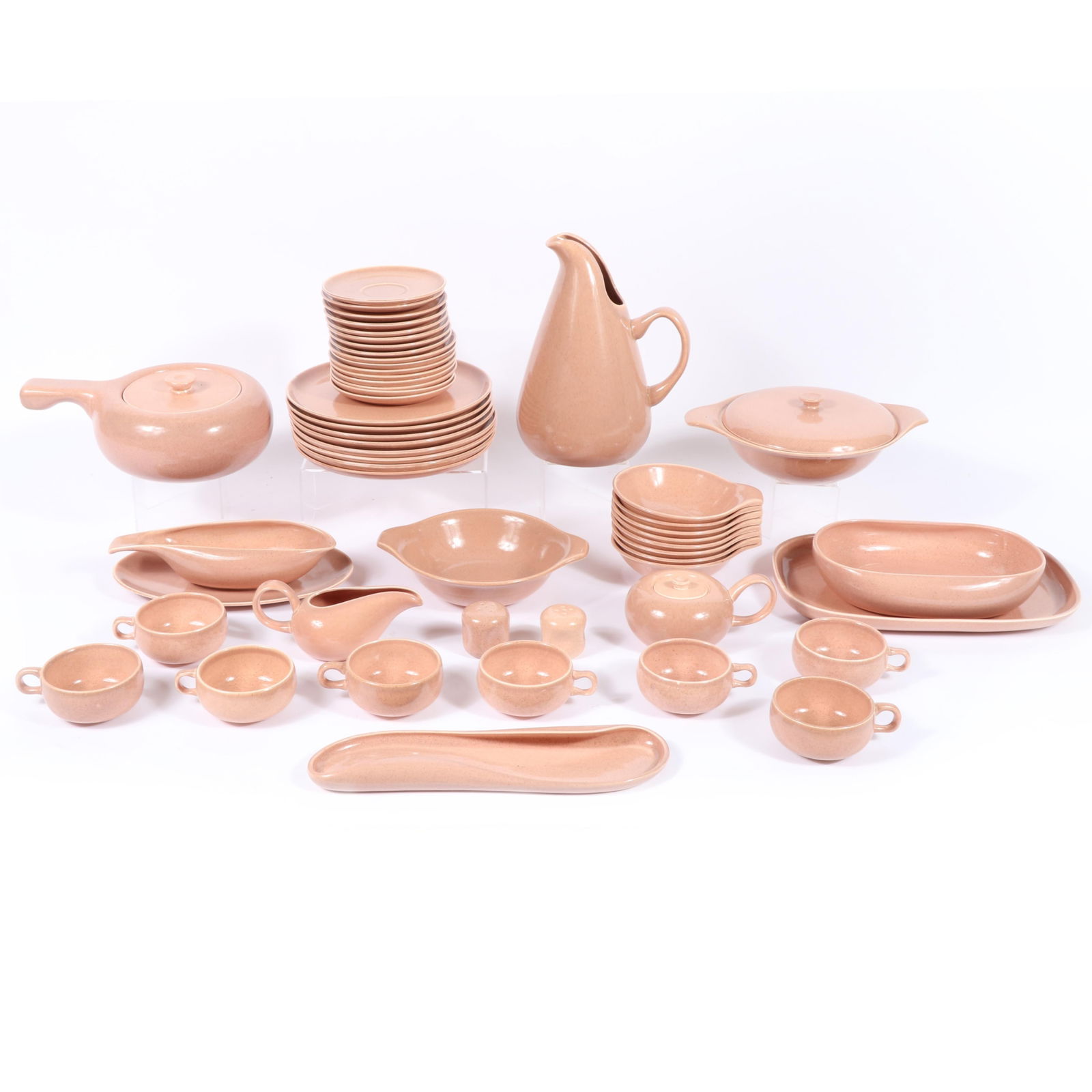 53 piece Russel Wright American Modern dinner set in coral, manufactured by Steubenville, 11" x 7" x: 53 piece Russel Wright American Modern dinner set in coral, manufactured by Steubenville, 8 cups (one with a small chip), 8 saucers, 8 B and B's 6", 8 dinner plates 10", 8 lug soup bowls, salt and pep