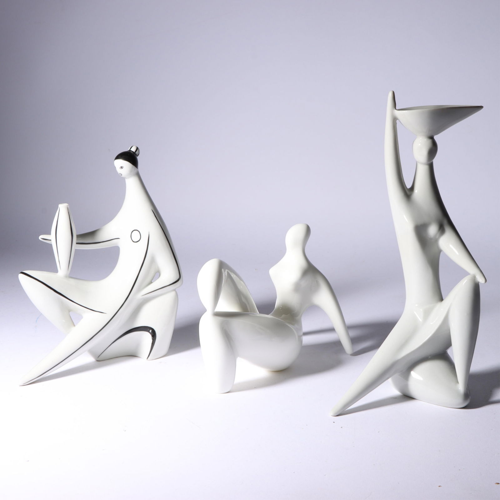 Three porcelain modernist nude female figures: 2 Zsolnay Torok Janos figurines, Hungary, and an: Three porcelain modernist nude female figures: 2 Zsolnay Torok Janos figurines, Hungary, and an Elegant bone china figurine 7 3/4"H x 4"W x 2 3/4"D (tallest)