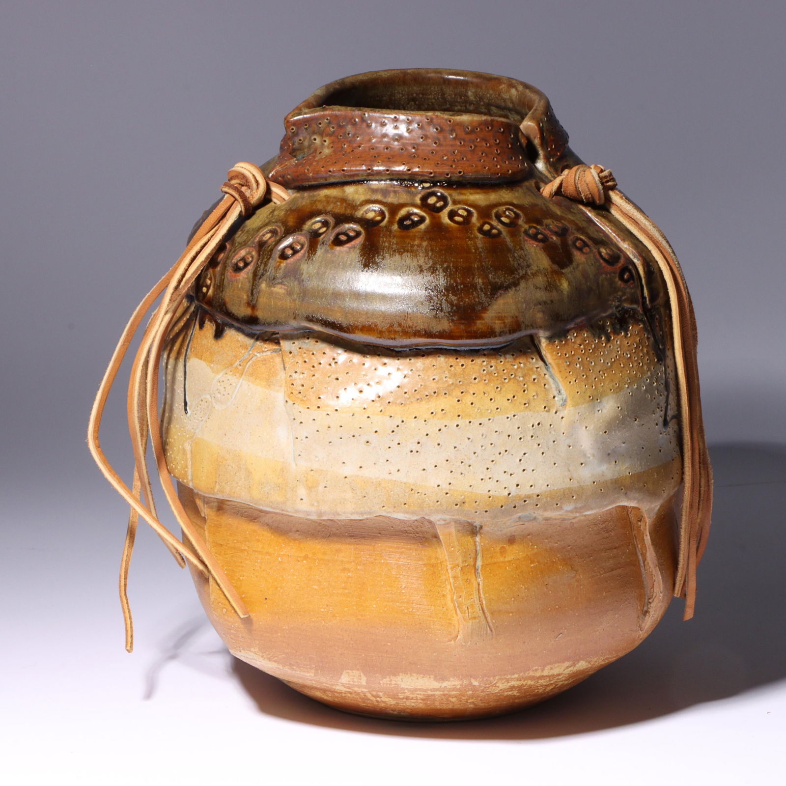 Tony Cox, American (20th/21st century), art pottery vessel, 2008, stoneware, leather, 10 1/4"H x 8 (1 of 10)