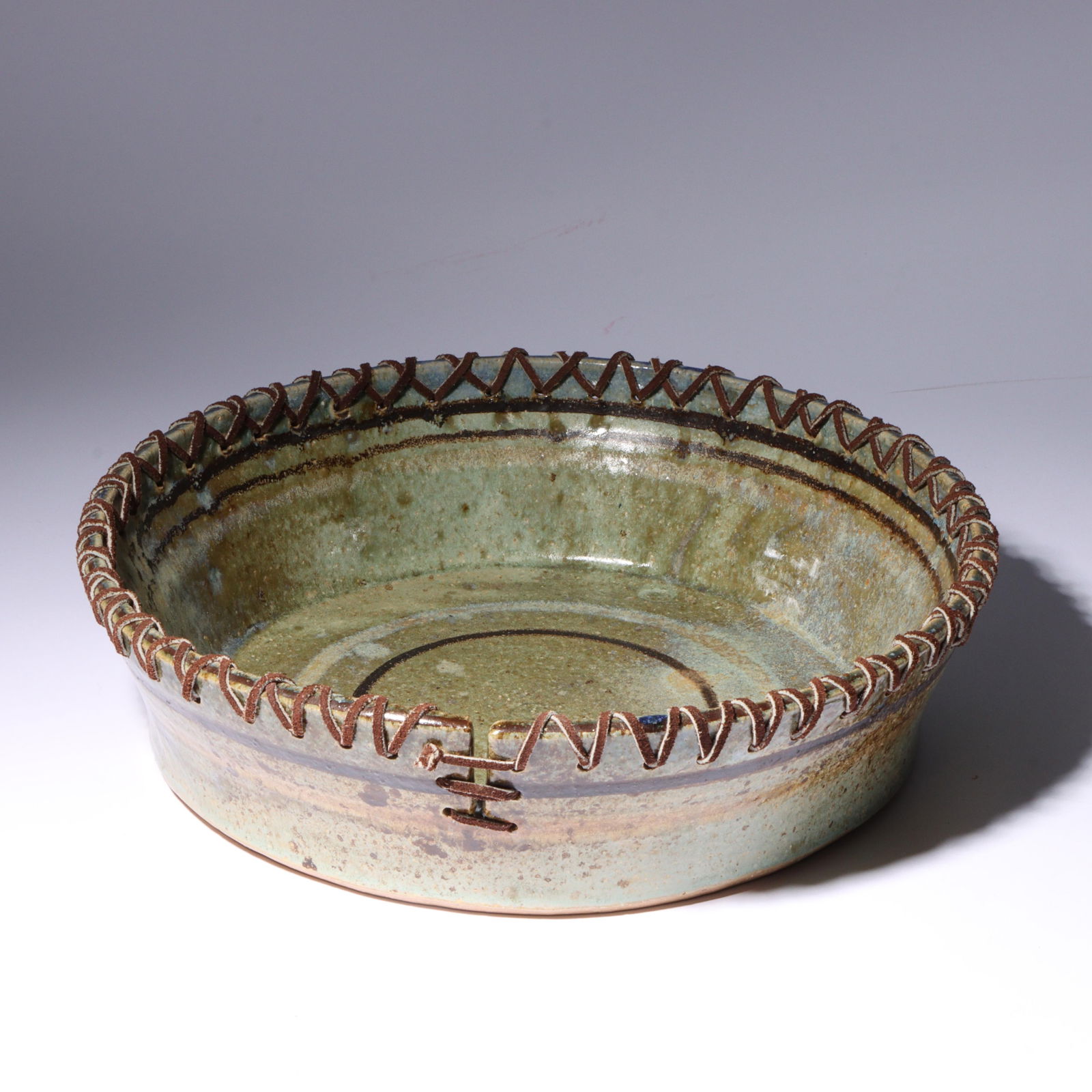 Tony Cox, American (20th/21st century), art pottery bowl, 1998, stoneware, leather, 3 1/2"H x (1 of 7)