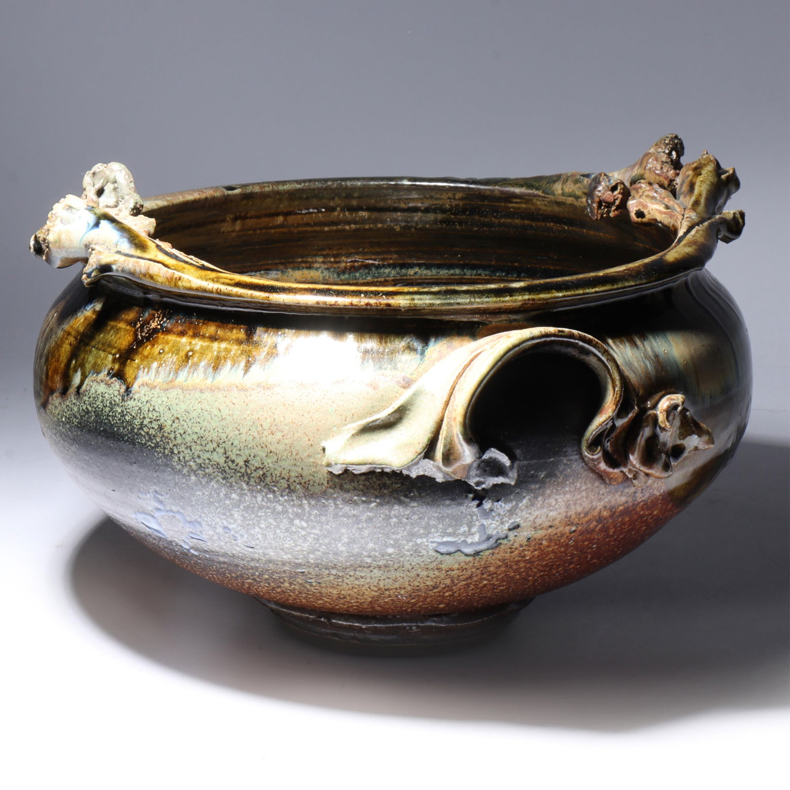 Don (Donald) Reitz, American (1929 - 2014), studio pottery jardiniere, glazed stoneware, 8 1/2"H x: Don (Donald) Reitz American (1929 - 2014) studio pottery jardiniere glazed stoneware Incised signature under base. Biography from the Archives of askART: "Don Reitz: Clay, Fire, Salt, and Wood" by Jod