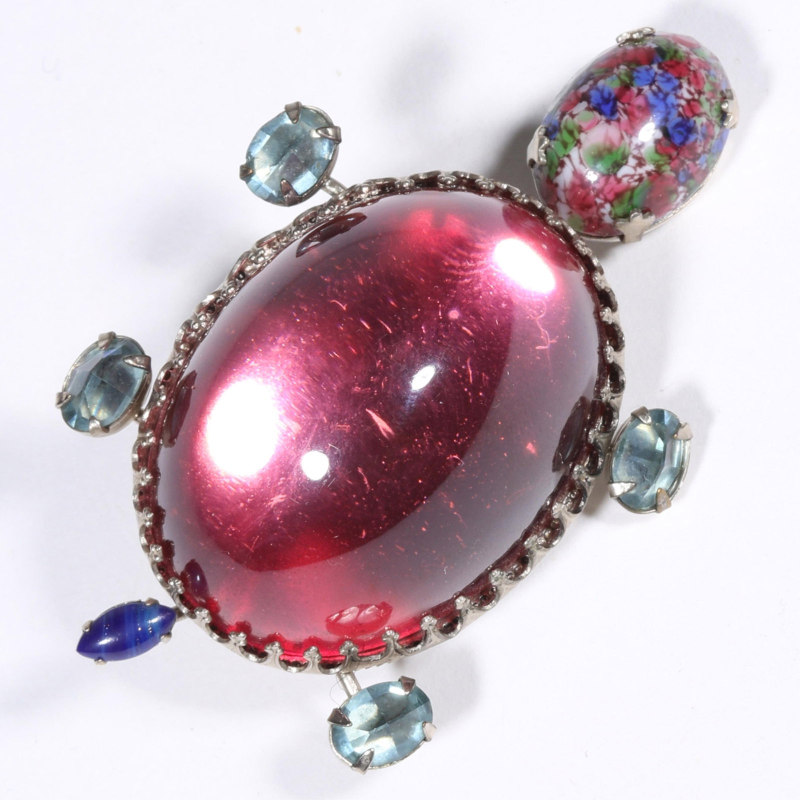 Schreiner New York turtle brooch with trembler art glass cabochon head, large pink Lucite cabochon: Schreiner New York turtle brooch with trembler art glass cabochon head, large pink Lucite cabochon shell, and inverted aqua crystals. Trembler head has been repaired. 2 3/4"H x 2"W