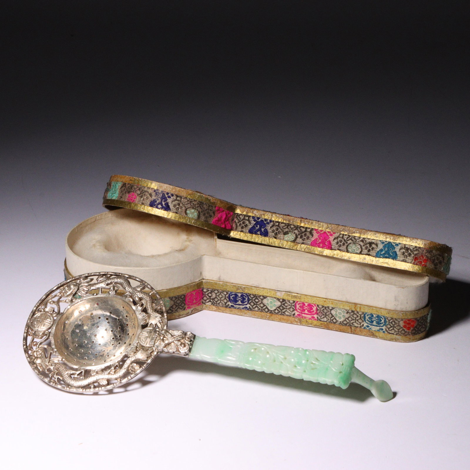 Chinese reticulated silver ornamental tea strainer with dragon motif and carved white jadeite jade (1 of 5)