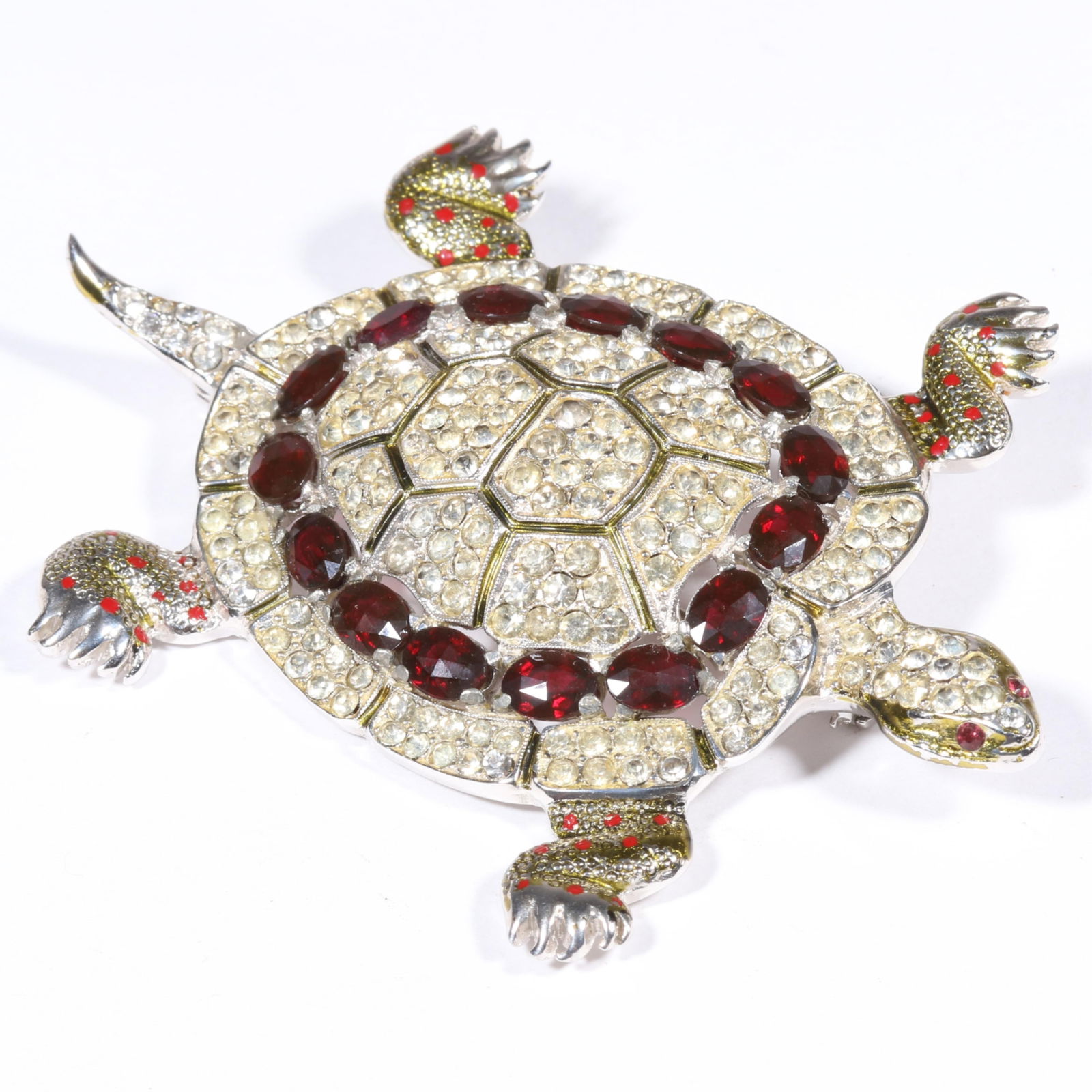 Vintage Book Piece Adolf Katz for Coro 1942 rhodium plated "Strass turtle" brooch with ruby red: Vintage Book Piece Adolf Katz for Coro 1942 rhodium plated "Strass turtle" brooch with ruby red crystals, clear rhinestones, and enamel. American Costume Jewelry A-M by Carla Ginelli Brunialti and Rob