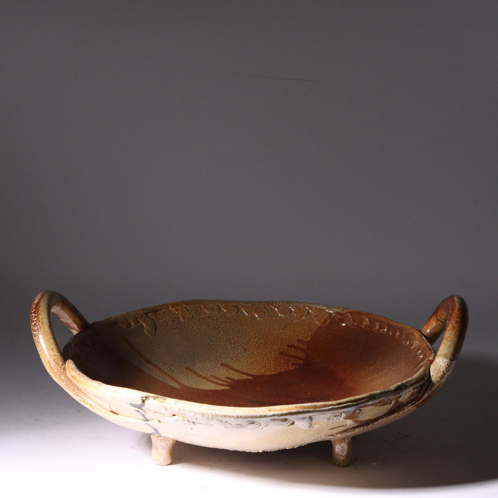 Don (Donald) Reitz, American (1929 - 2014), footed studio pottery bowl with handles, glazed: Don (Donald) Reitz American (1929 - 2014) footed studio pottery bowl with handles glazed stoneware Incised signature under base. Biography from the Archives of askART: "Don Reitz: Clay, Fire, Salt, an