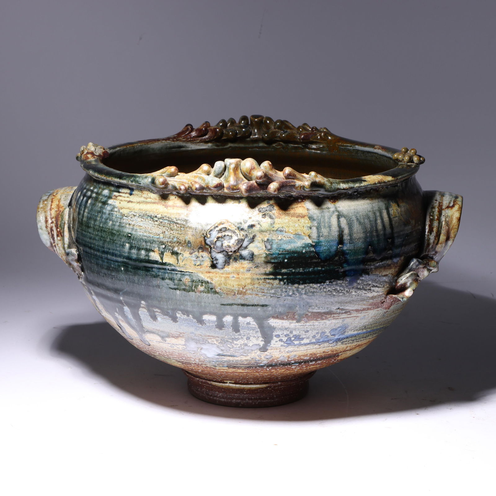 Don (Donald) Reitz, American (1929 - 2014), studio pottery jardiniere, glazed stoneware, 8 3/4"H x: Don (Donald) Reitz American (1929 - 2014) studio pottery jardiniere glazed stoneware Incised signature under base. Biography from the Archives of askART: "Don Reitz: Clay, Fire, Salt, and Wood" by Jod