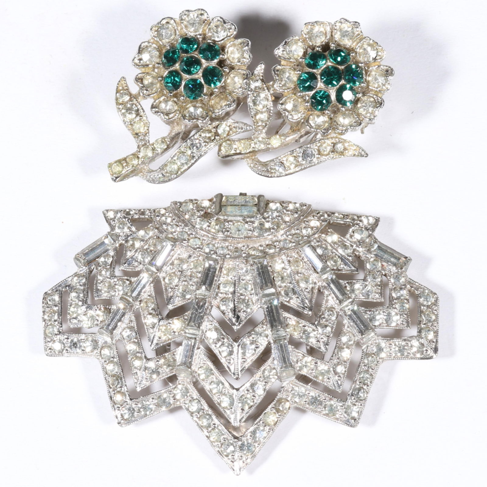 Coro Duette with pair of green and clear rhinestone crystal fur clips brooch and Coro Art Deco: Coro Duette with pair of green and clear rhinestone crystal fur clips brooch and Coro Art Deco diamante rhinestone dress clip. Provenance: From the collection of Cheryl Killmer. 1 7/8"H x 2 1/2"W (dre