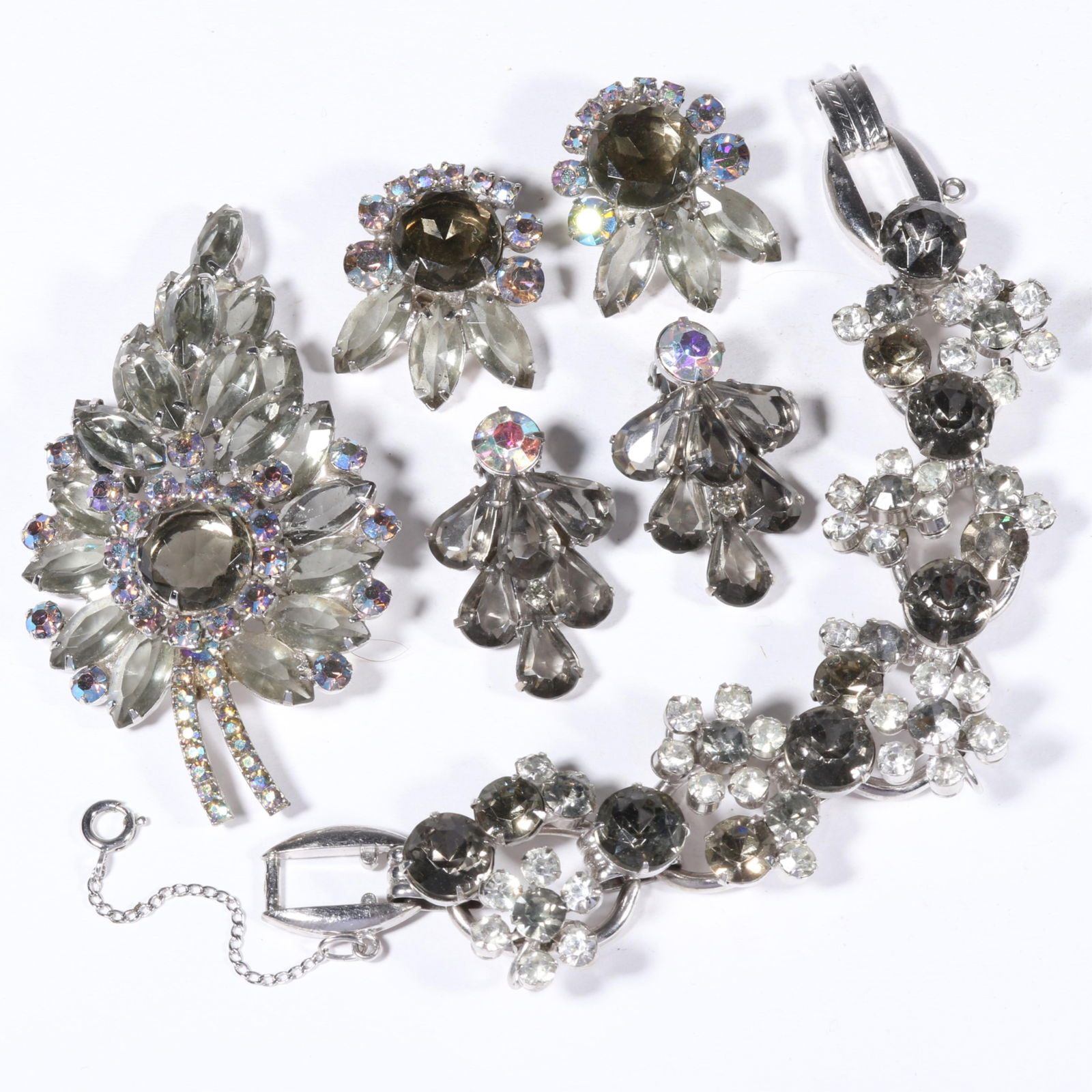 DeLizza & Elster Juliana shades of grey rhinestone crystal jewelry group. 7 1/2"L x 1 1/8"W: DeLizza & Elster Juliana shades of grey rhinestone crystal jewelry group. Provenance: From the collection of Cheryl Killmer. 7 1/2"L x 1 1/8"W (bracelet)