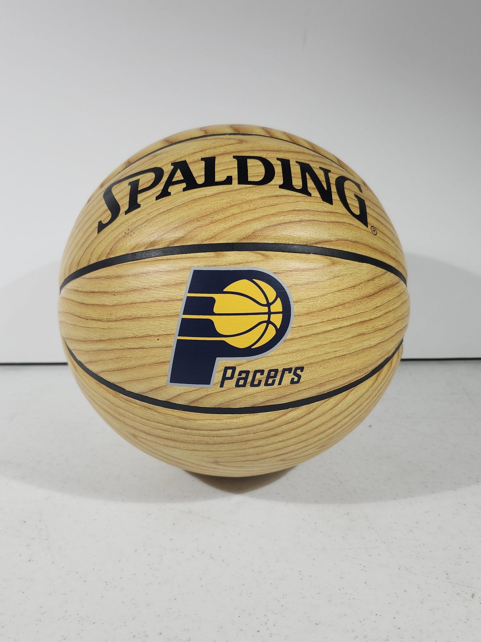 Indiana Pacers Logo Wood Grain Style Spalding Basketball: Indiana Pacers Logo Wood Grain Style Spalding Basketball Take your love for the Indiana Pacers to the next level with the Logo Wood Grain Style Spalding Basketball. Whether you're shooting hoops with 