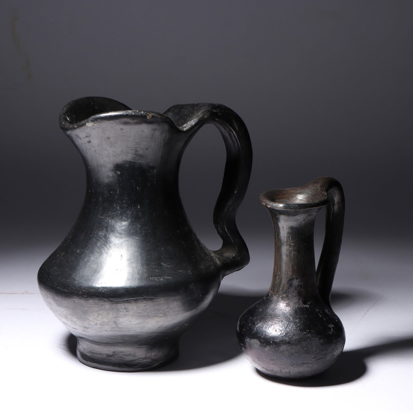 Pair of antique Native American Southwestern Santa Clara blackware handled pitcher/ewer vessels, (1 of 4)