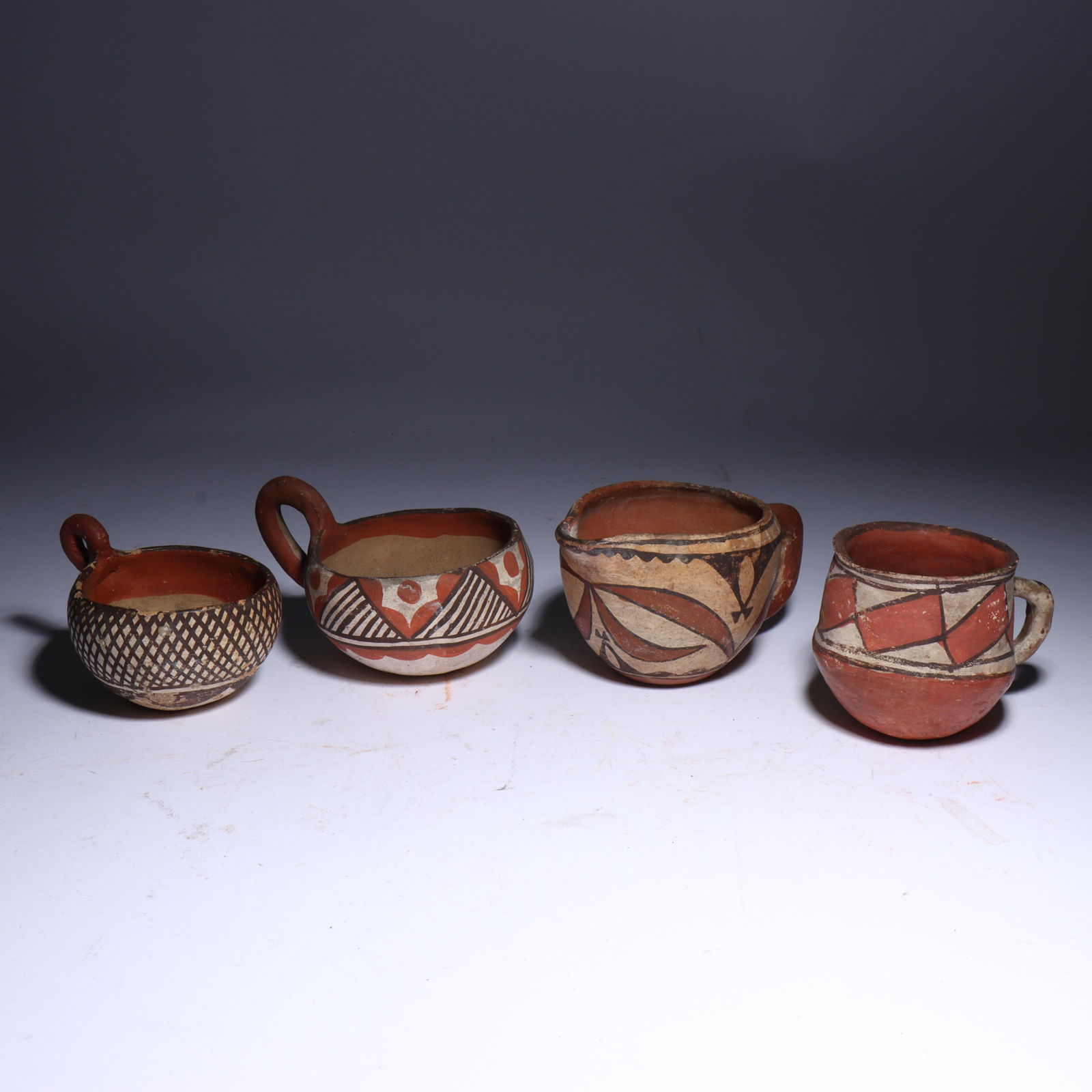 Group of 4 Native American Southwestern Acoma? Hopi? polychrome pottery cups and pitcher. 2 3/4"H x (1 of 7)