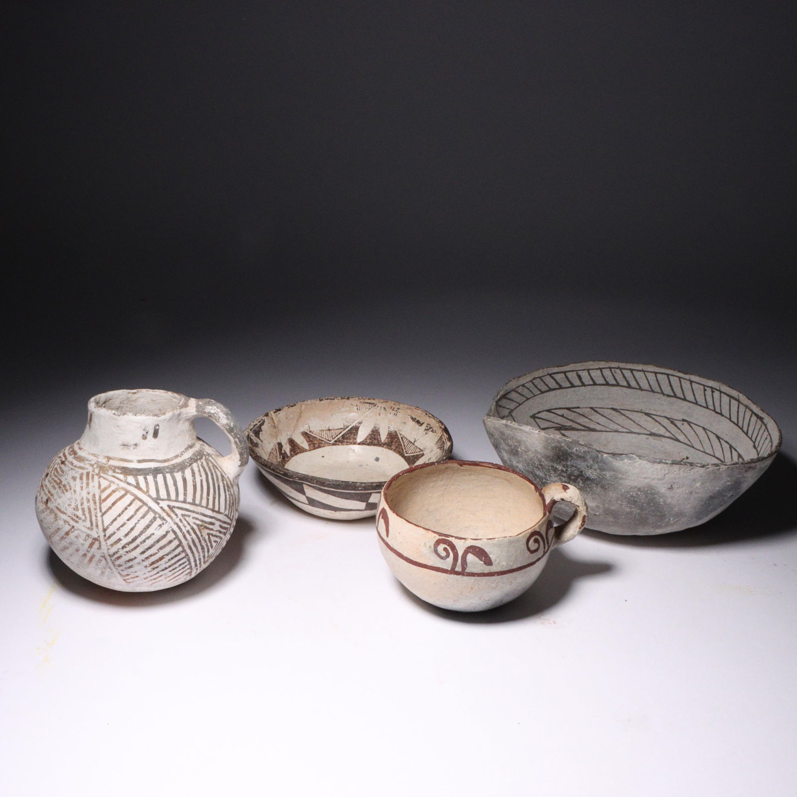 Four Native American polychrome pottery vessels including prehistoric Anasazi and Zuni: pitcher, (1 of 7)