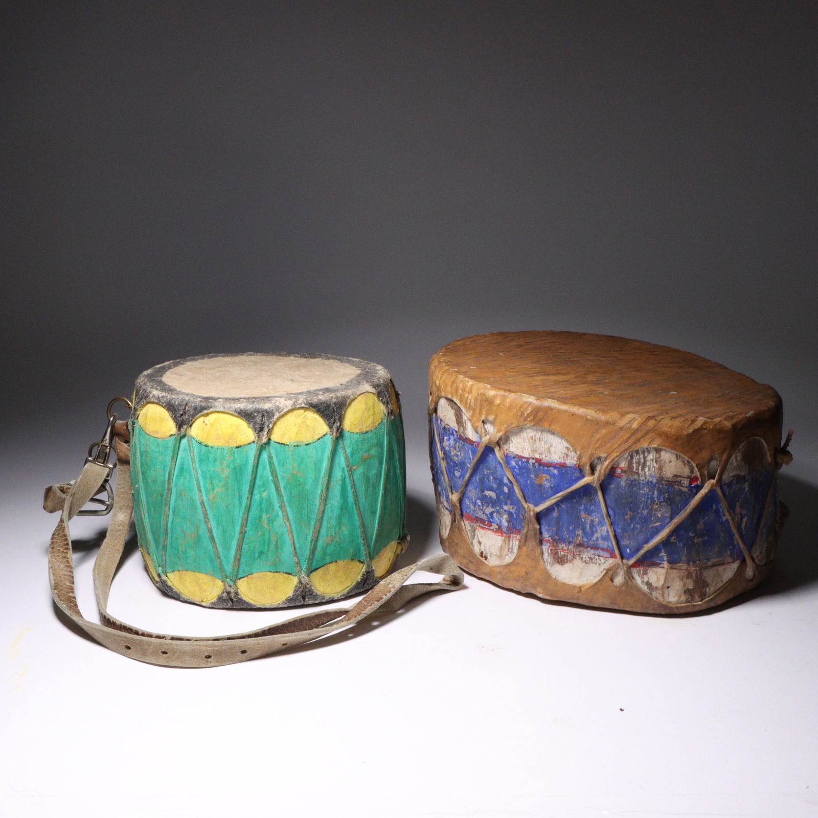 Two Cochiti Pueblo hand painted ceremonial drums; ca. early to mid 20th Century. 5 1/2"H x 8 3/4"W (1 of 5)