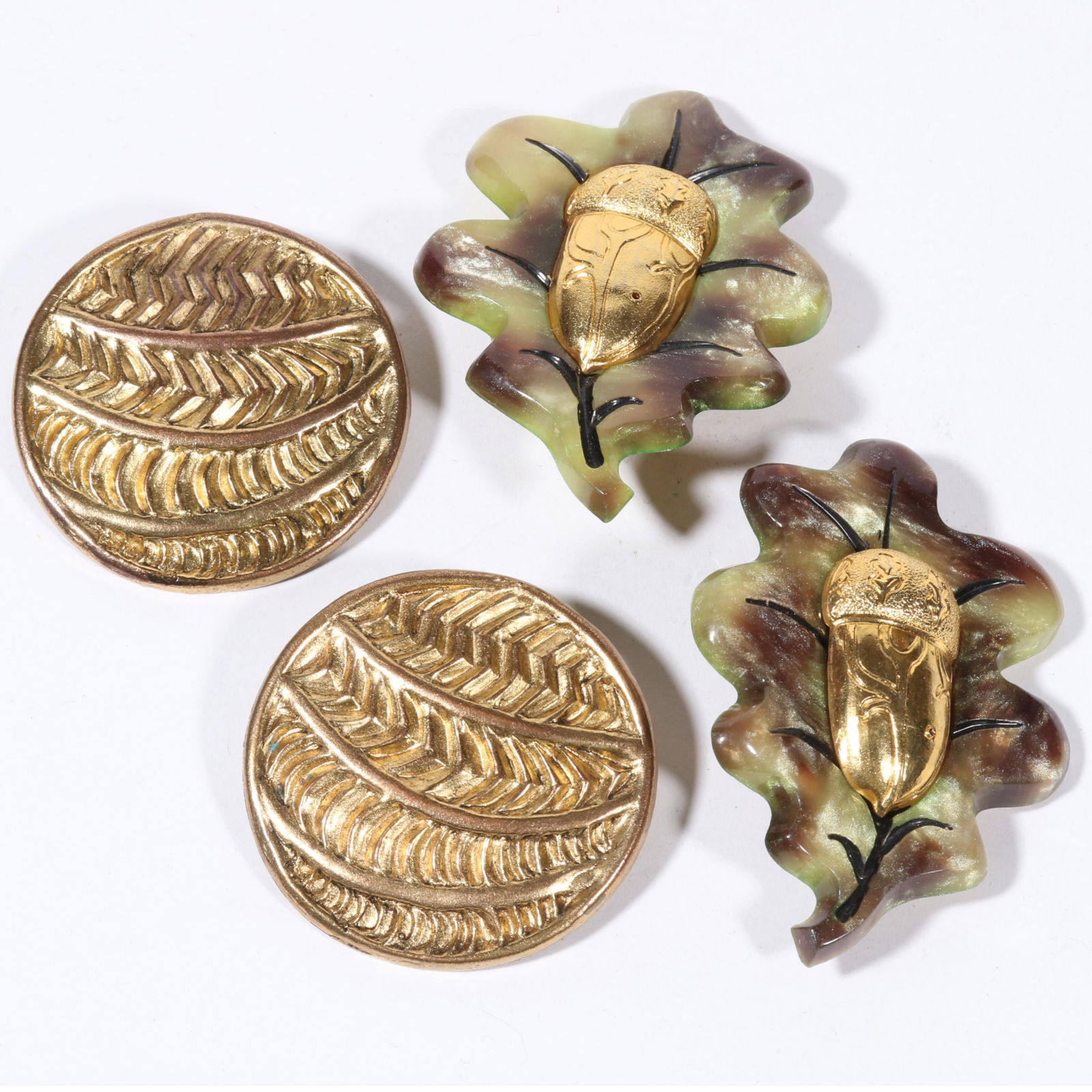 Two pairs of Isabel Canovas earrings with shimmer marbled resin gilded acorn earrings, and round: Two pairs of Isabel Canovas earrings with shimmer marbled resin gilded acorn earrings, and round patterned earrings. 2 3/4"H x 2"W (acorn earrings)