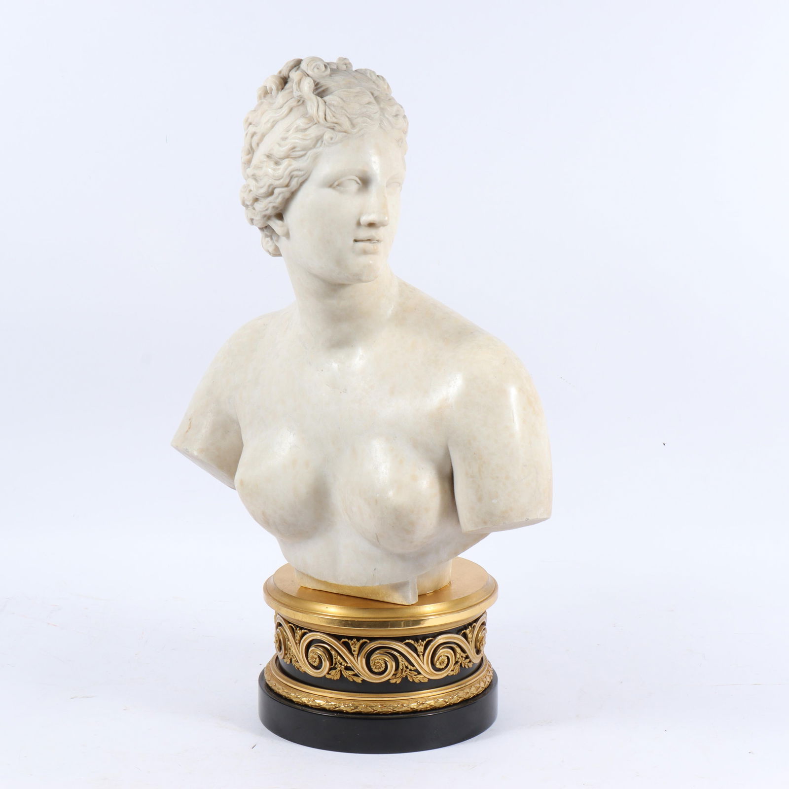 Italian carved Neoclassical white marble female nude bust of Venus on gilt bronze ormolu stand 27"H: Italian carved Neoclassical white marble female nude bust of Venus on gilt bronze ormolu stand Loose from stand. 27"H x 16 1/2"W - sculpture and stand together