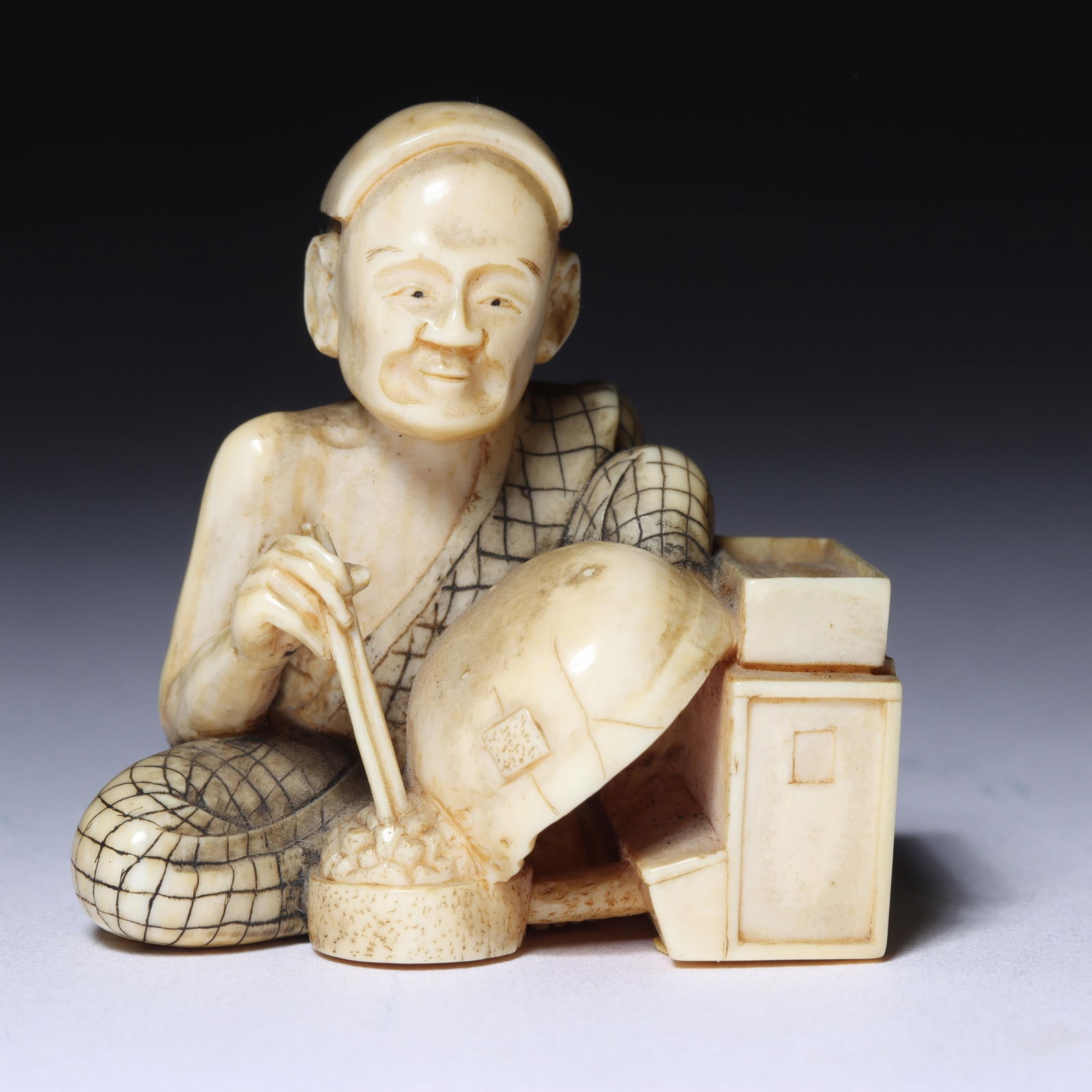 Japanese carved figural netsuke: elder man food merchant with chopsticks and a bowl and storage (1 of 6)