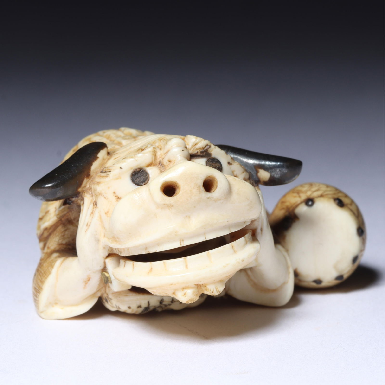 Japanese carved mechanical netsuke figure of a young boy playing with a Qilin / Shishi / Foo dog (1 of 8)
