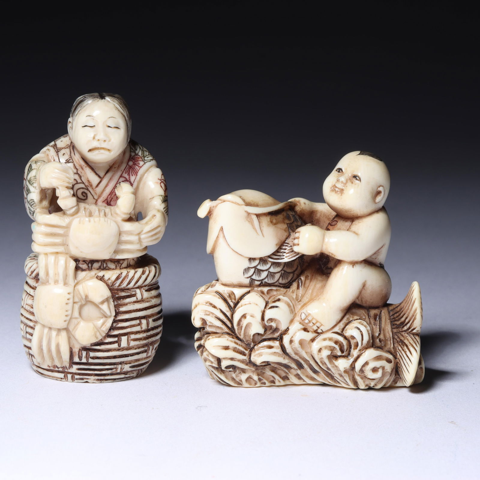 Japanese carved figural netsuke 2pc group: young child riding a carp fish with glass eye and details (1 of 9)