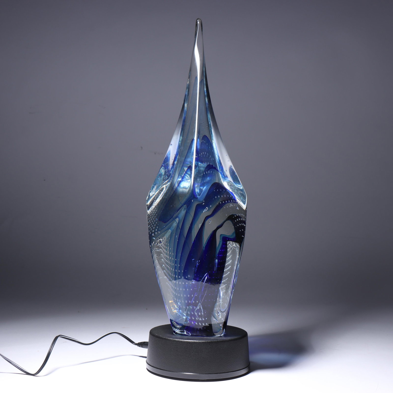 Scott Hartley, American (20th/21st century), Transparent Glory, art glass sculpture on lighted base,: Scott Hartley American (20th/21st century) Transparent Glory art glass sculpture on lighted base Includes receipt of sale. Biography from InfinityArtGlass.com: Sitting in church, a young child was han
