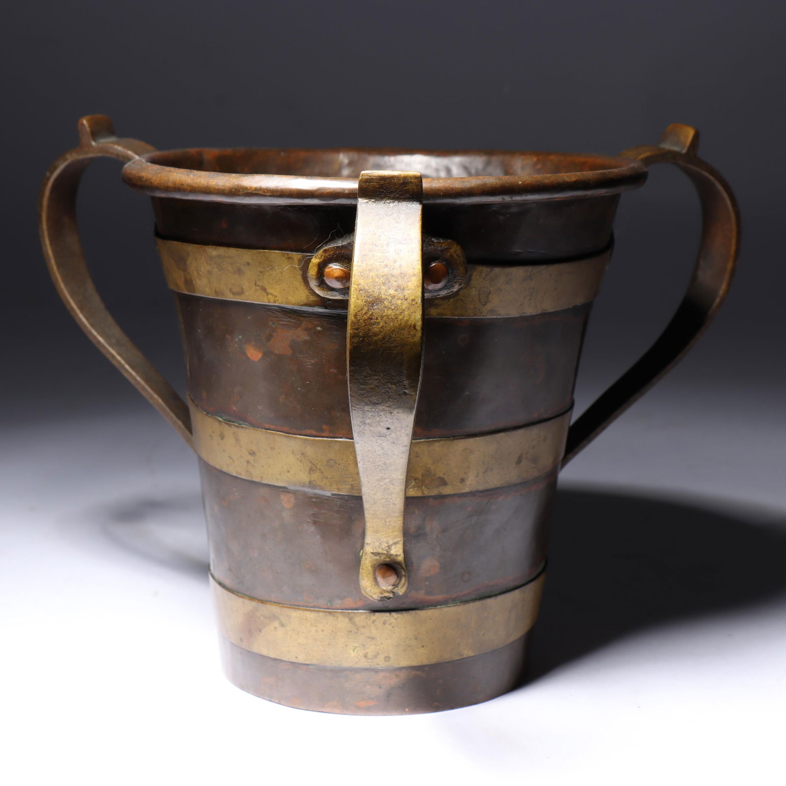 Russian Tyg 5 1/2"H x 5 1/2"Diam.: Russian Tyg Copper with brass handles and bands; Impressed Russian double headed imperial eagle mark. Provenance: Charles Alexander, Indianapolis, IN 5 1/2"H x 5 1/2"Diam.