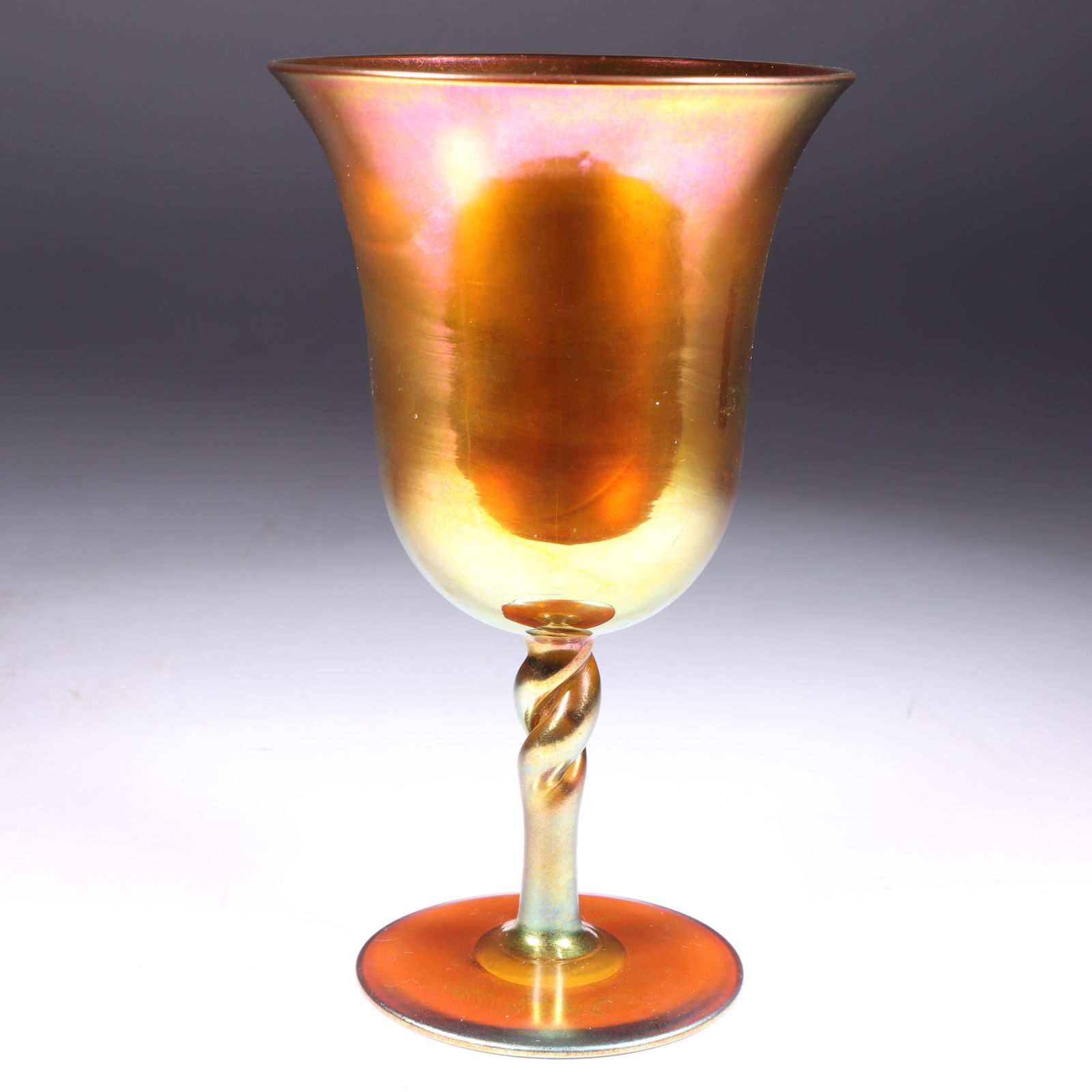 Steuben Gold Aurene art glass twist stem wine goblet. 6"H: Steuben Gold Aurene art glass twist stem wine goblet. 6"H