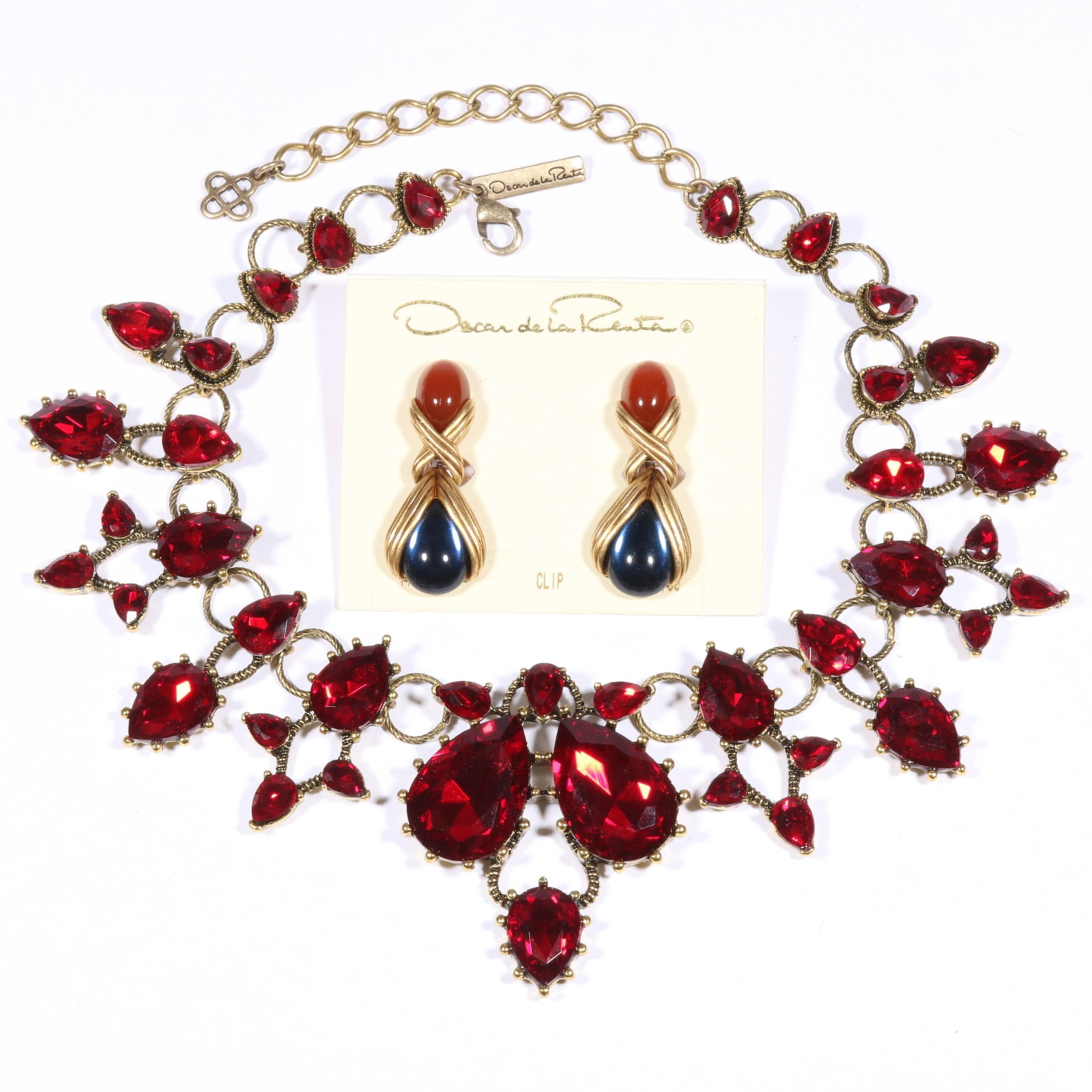 Oscar de la Renta Designer couture red rhinestone crystal necklace with clip cabochon drop earrings: Oscar de la Renta Designer couture red rhinestone crystal necklace with clip cabochon drop earrings on original card. From the Collection of Connie DeNave "JewelDiva" 18"L x 2 3/8"W (necklace)
