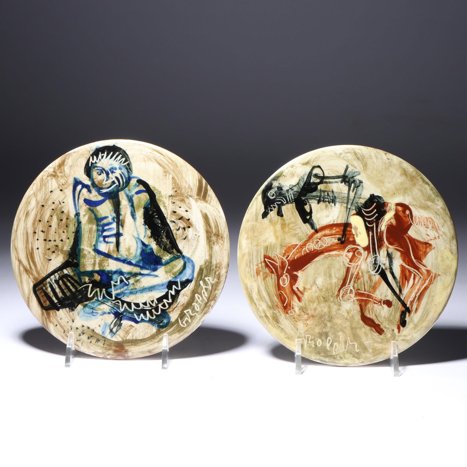 William Gropper, New York (1897 - 1977), seated figure, Don Quixote, 2 painted porcelain plaques,: WilliamGropperNew York(1897 - 1977)seated figure, Don Quixote2 painted porcelain plaquesSigned lower. Biography from The Johnson Collection: William Gropper was a painter and political cartoonist who