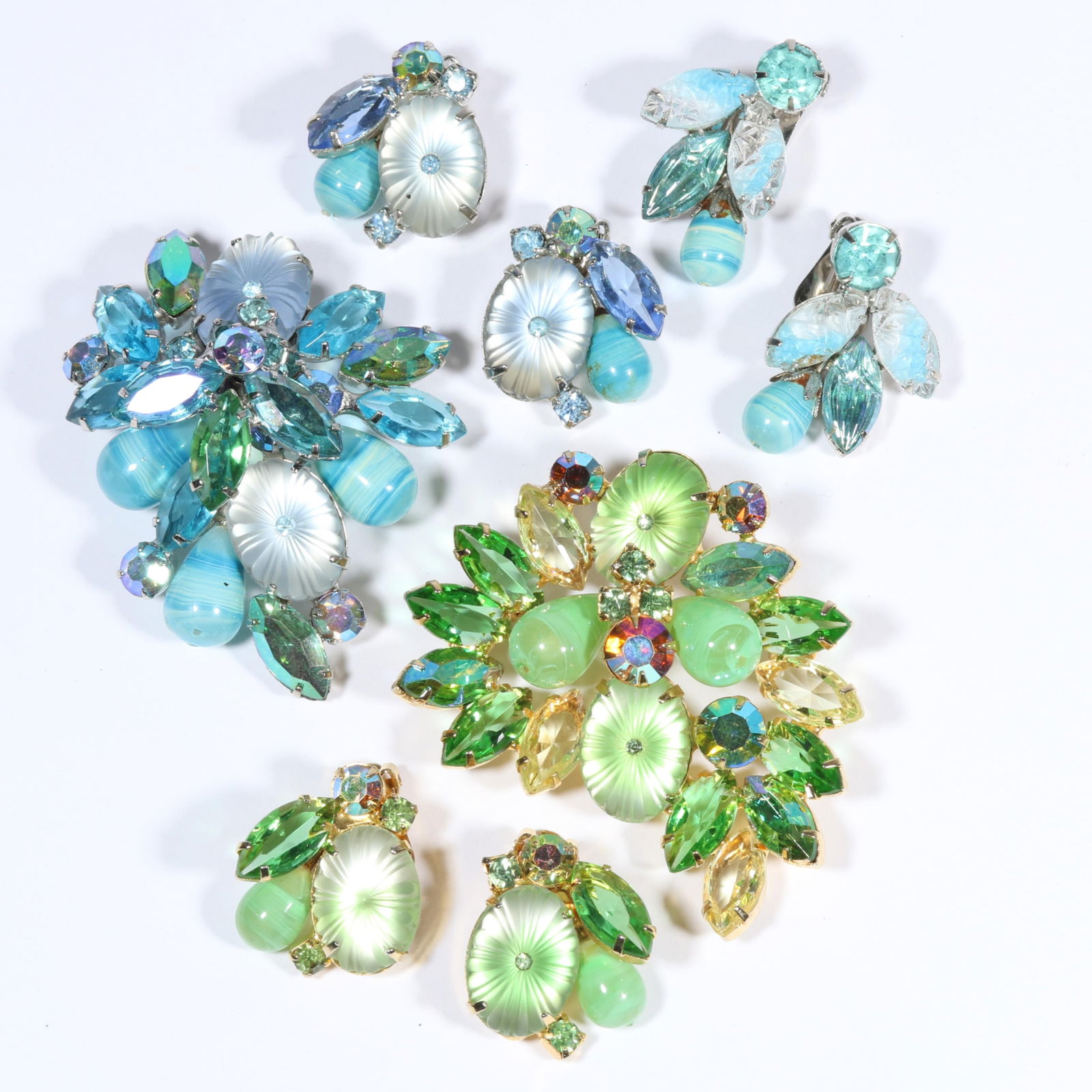 Book Piece DeLizza & Elster Juliana green and blue frosted pillow stone brooches and matching: Book Piece DeLizza & Elster Juliana green and blue frosted pillow stone brooches and matching earrings with pair of complementary Juliana earrings.One green earring missing middle rhinestone. Book: Th