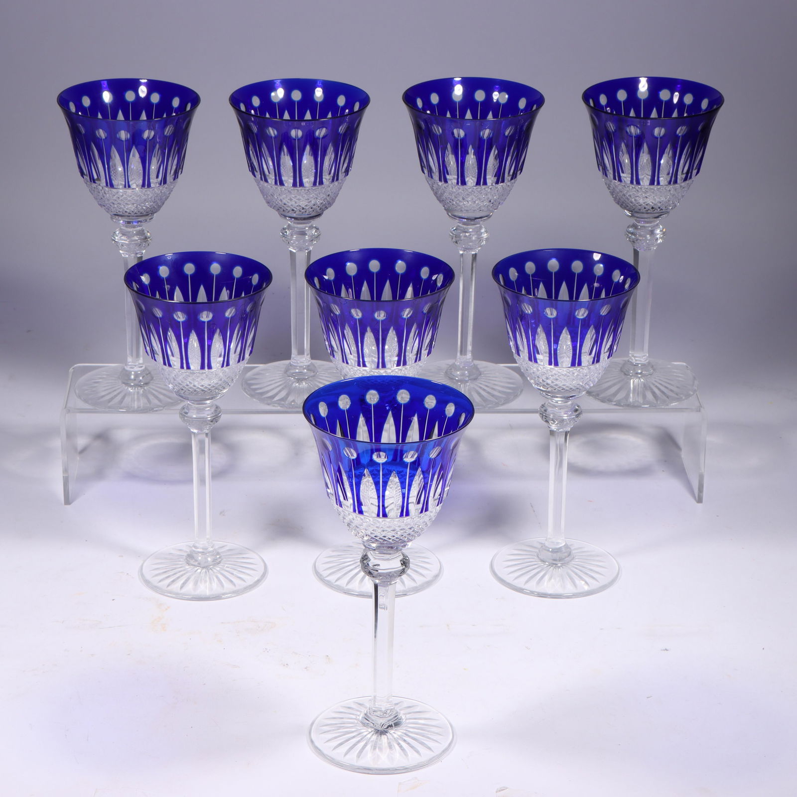 Set of 8 St Louis cobalt cut to clear "Tommy" crystal stems; wine goblets. 7 3/4"H x 3 1/2"Diam.: Set of 8 St Louis cobalt cut to clear "Tommy" crystal stems; wine goblets. This set is in good/excellent condition with no chips, cracks, or flaws to report. There is little to no visible wear. 7 3/4"
