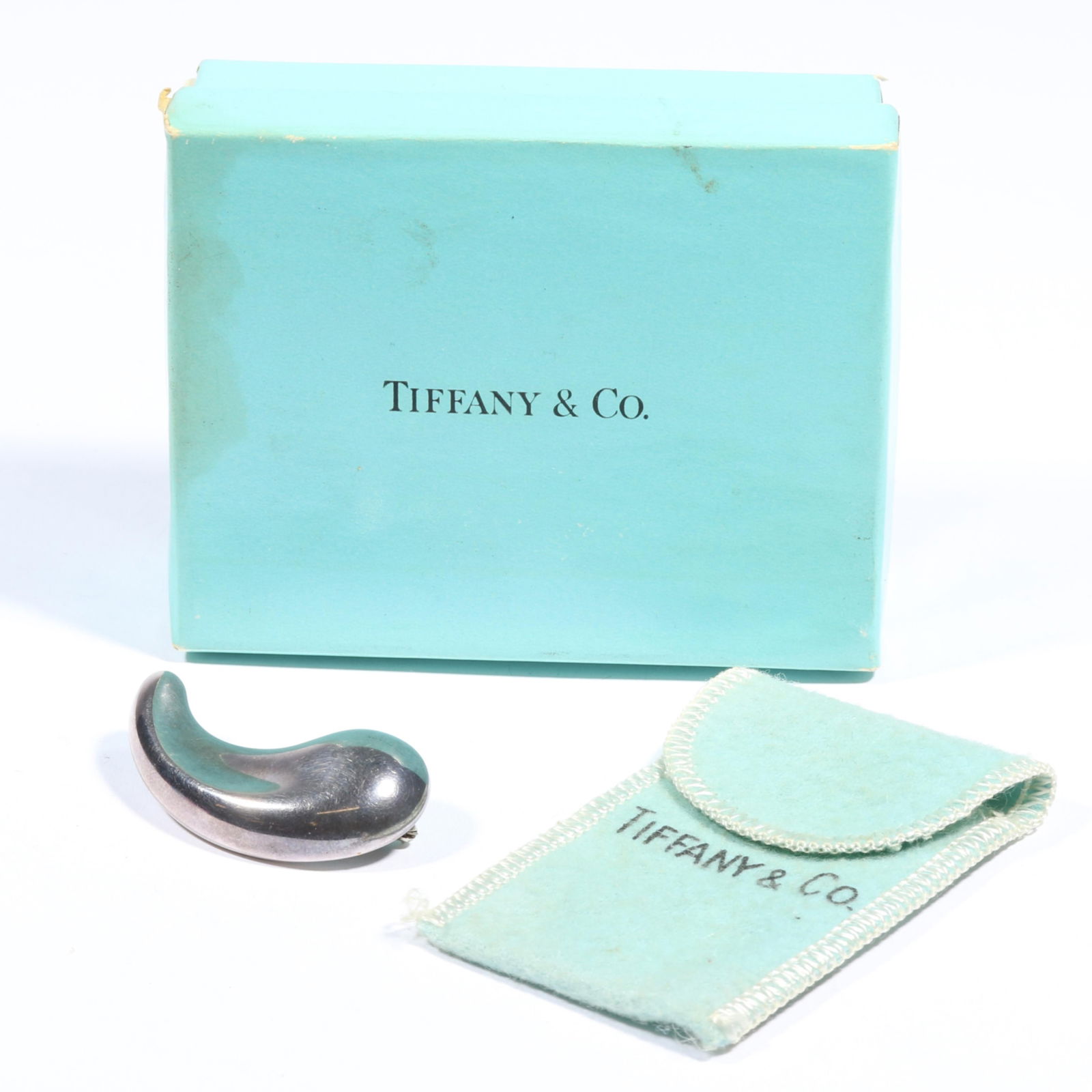 Tiffany & Co. sterling silver Elsa Peretti modernist teardrop brooch with original dust bag and box.: Tiffany & Co. sterling silver Elsa Peretti modernist teardrop brooch with original dust bag and box. Light scratches to surface of sterling, some wear to box. 1 3/4"L x 1"W