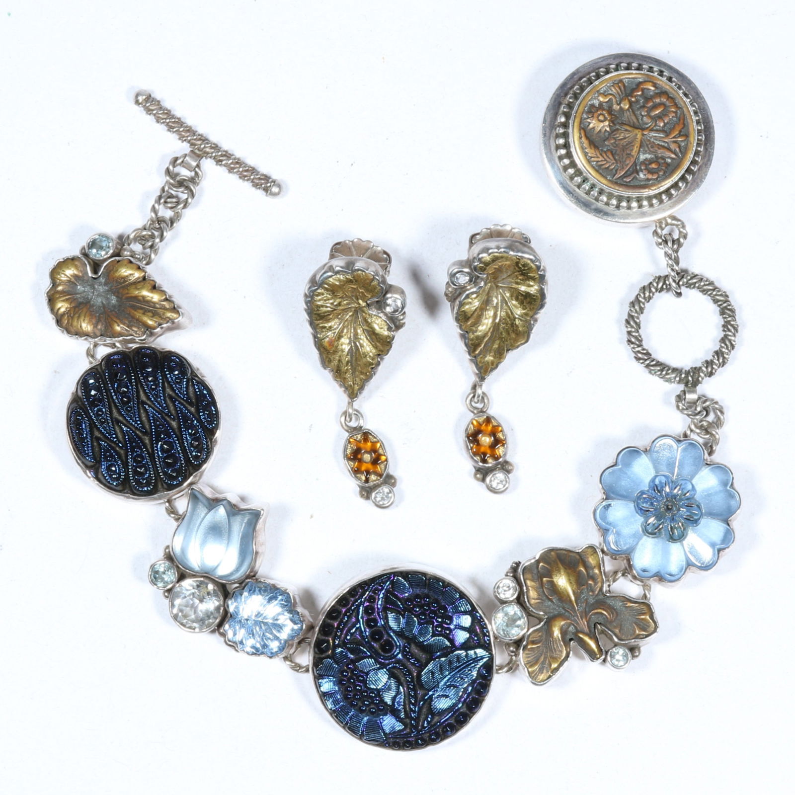 Echo of the Dreamer Margaret Thurman sterling silver jewelry set including Czech glass, white topaz,: Echo of the Dreamer Margaret Thurman sterling silver jewelry set including Czech glass, white topaz, and mixed metals botanical themed bracelet and matching post earrings. 7 1/4"L x 1 1/8"W (bracelet)