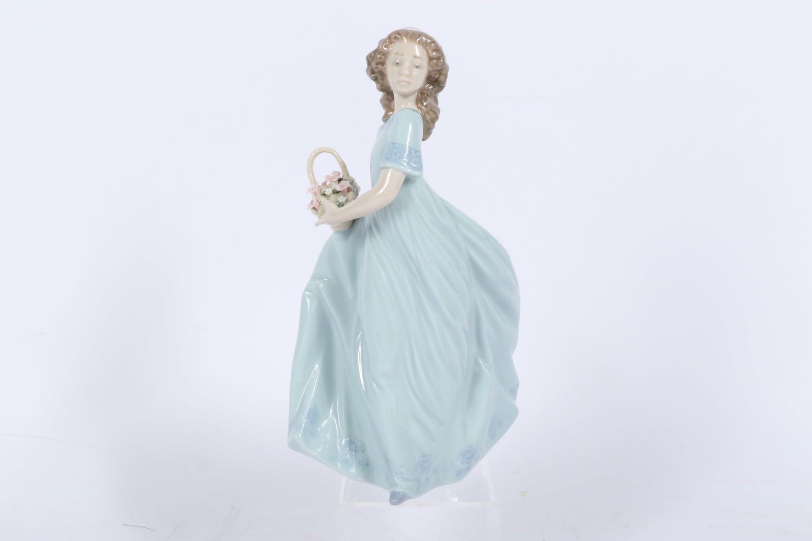 Lladro 'Spring Enchantment' porcelain figurine #6130 9 1/2'H: Lladro "Spring Enchantment" porcelain figurine #6130 It was sculpted by Regino Torrijos, issued in 1996, and retired in 2004. 9 1/2"H