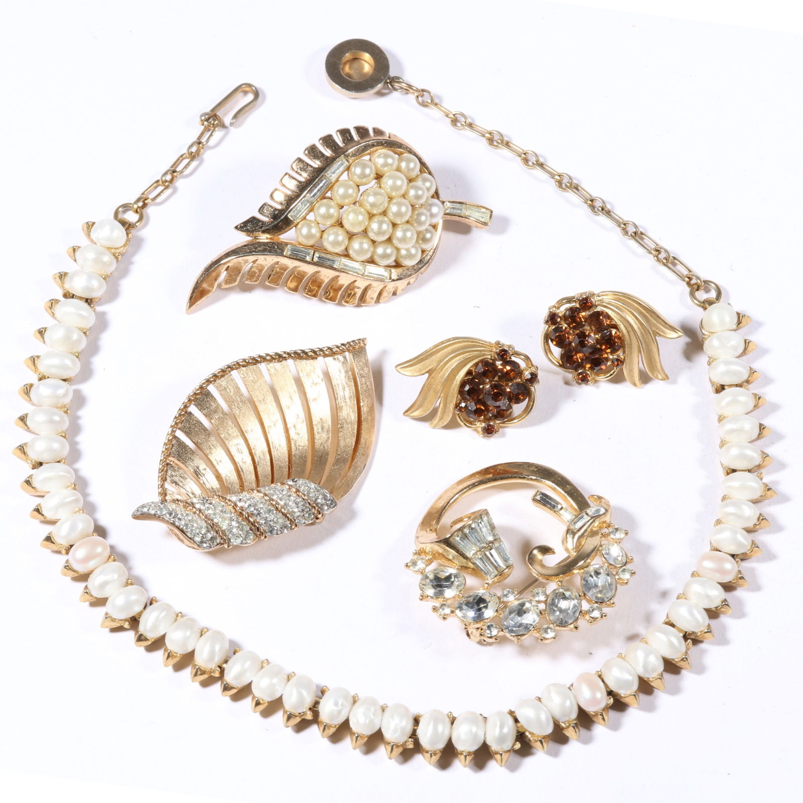 Crown Trifari retro costume jewelry group including faux pearl necklace, rhinestone crystal brooches: Crown Trifari retro costume jewelry group including faux pearl necklace, rhinestone crystal brooches and earrings. With one original tag. 15 1/2"L x 3/8"W (necklace)