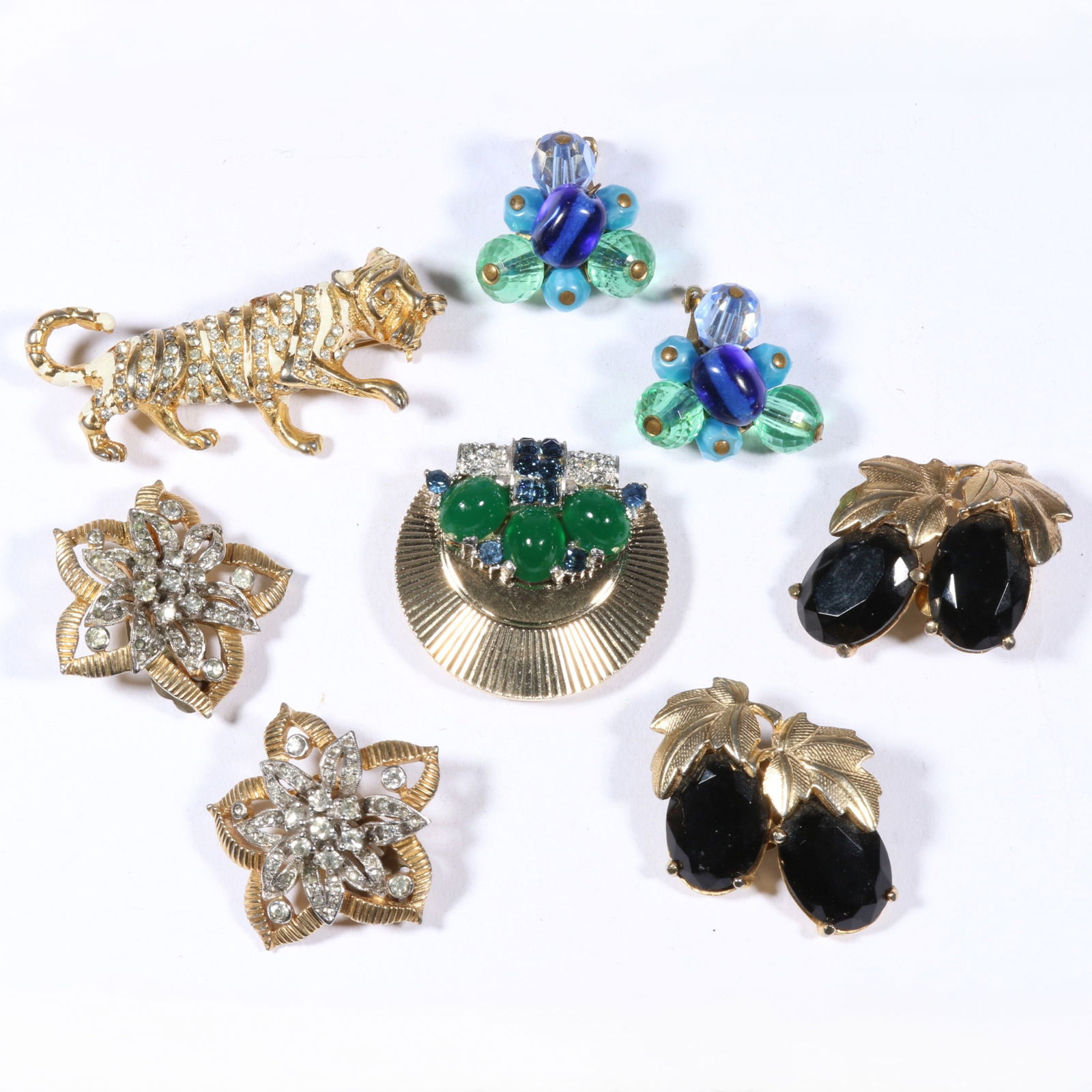 Schiaparelli, Jomaz, Hattie Carnegie, and unsigned Marcel MB Boucher rhinestone crystal jewelry: Schiaparelli, Jomaz, Hattie Carnegie, and unsigned Marcel MB Boucher rhinestone crystal jewelry group. Tiger and art glass earrings are Carnegie, flower earrings are Jomaz, black berry earrings are Sc