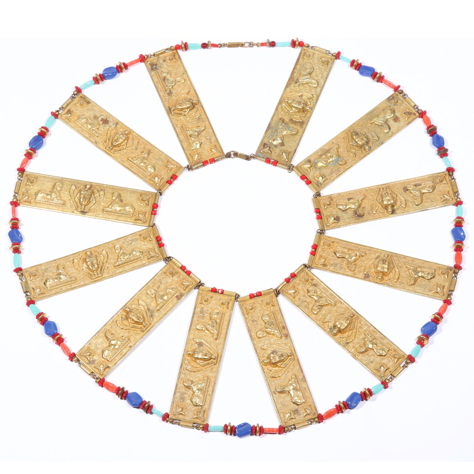 Miriam Haskell HUGE Egyptian Revival collar necklace with gilt repousse winged pharaoh and sphinx: Miriam Haskell HUGE Egyptian Revival collar necklace with gilt repousse winged pharaoh and sphinx panels and faux coral, lapis and turquoise glass beads. 15 1/4"L x 4"WProvenance: Inga Levin at Queens