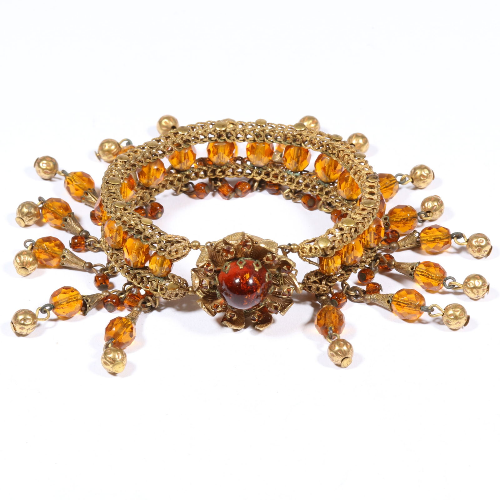 Early Miriam Haskell faceted amber glass beaded drop bracelet with ornate floral amber gold fleck: Early Miriam Haskell faceted amber glass beaded drop bracelet with ornate floral amber gold fleck cabochon clasp, unsigned. 7 1/2"L x 2"Drop