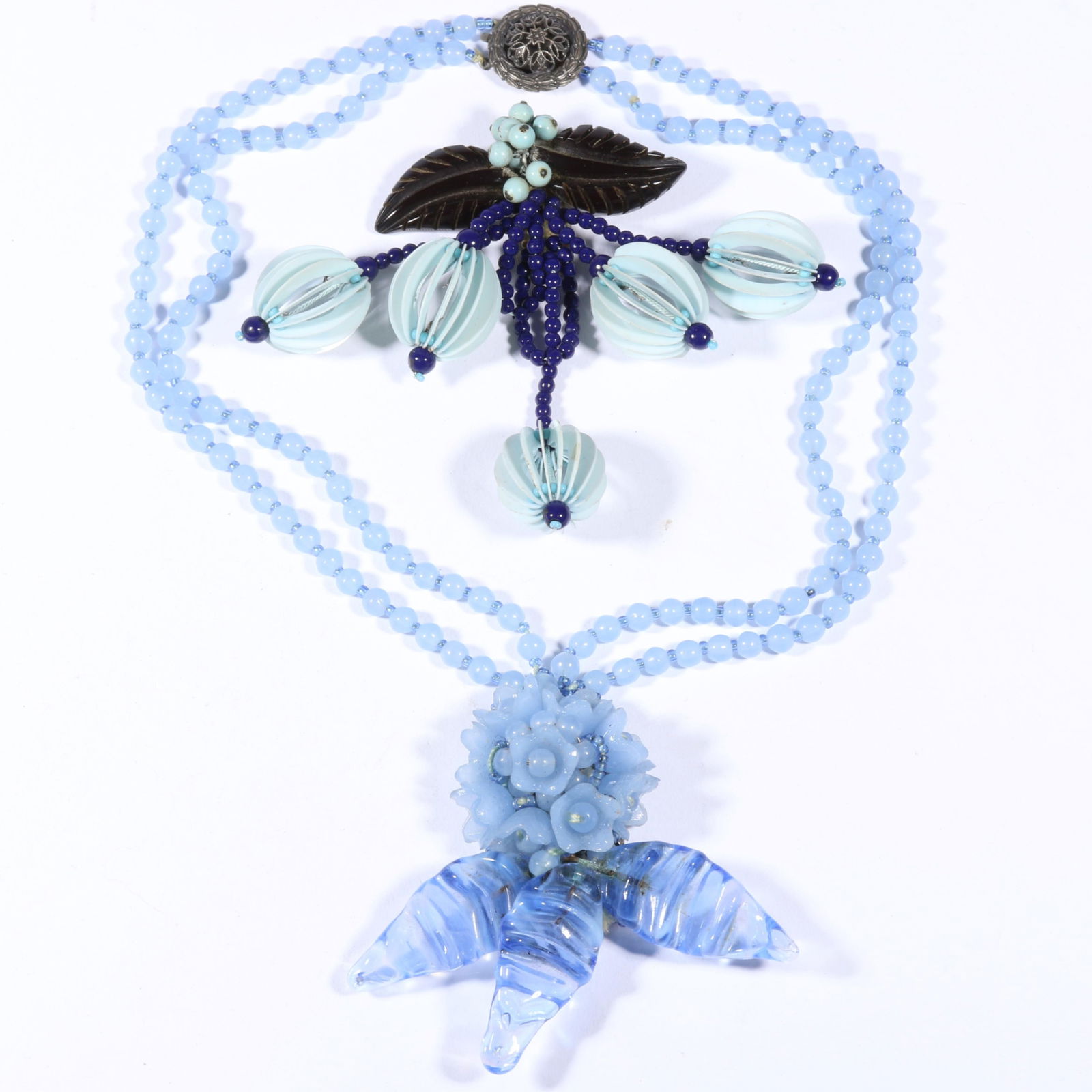 Unsigned early Miriam Haskell Book Pieces including beaded dress clip with lampshade drops and: Unsigned early Miriam Haskell Book Pieces including beaded dress clip with lampshade drops and carved Bakelite leaves with floral ice blue art glass necklace. Book Reference: Miriam Haskell Jewelry by