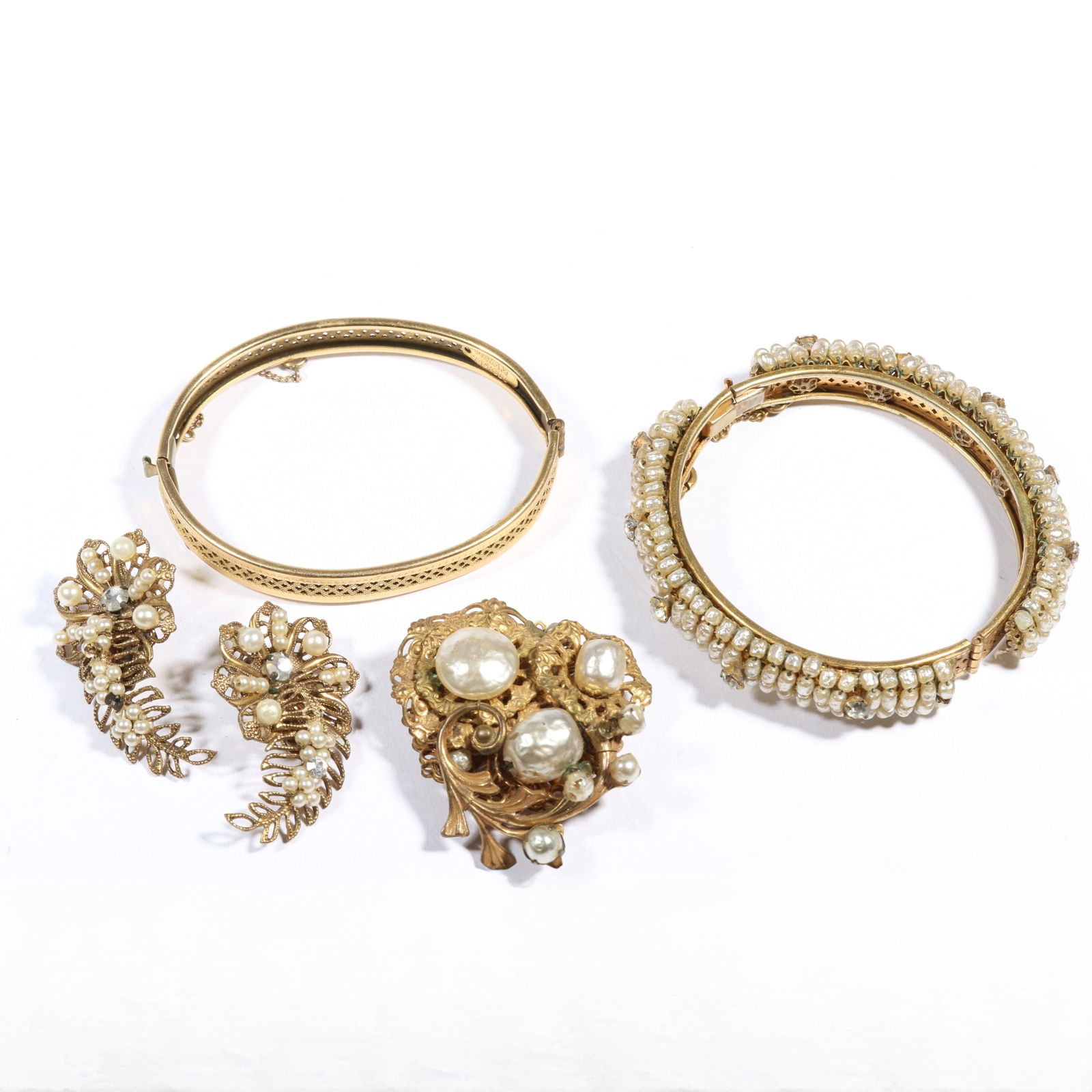 Miriam Haskell jewelry group including rhinestone and seed pearl bracelet, floral faux pearl brooch,: Miriam Haskell jewelry group including rhinestone and seed pearl bracelet, floral faux pearl brooch, faux pearl earrings and bracelet blank. 3/8"H x 2 1/8"Inner Diameter (faux pearl bracelet)