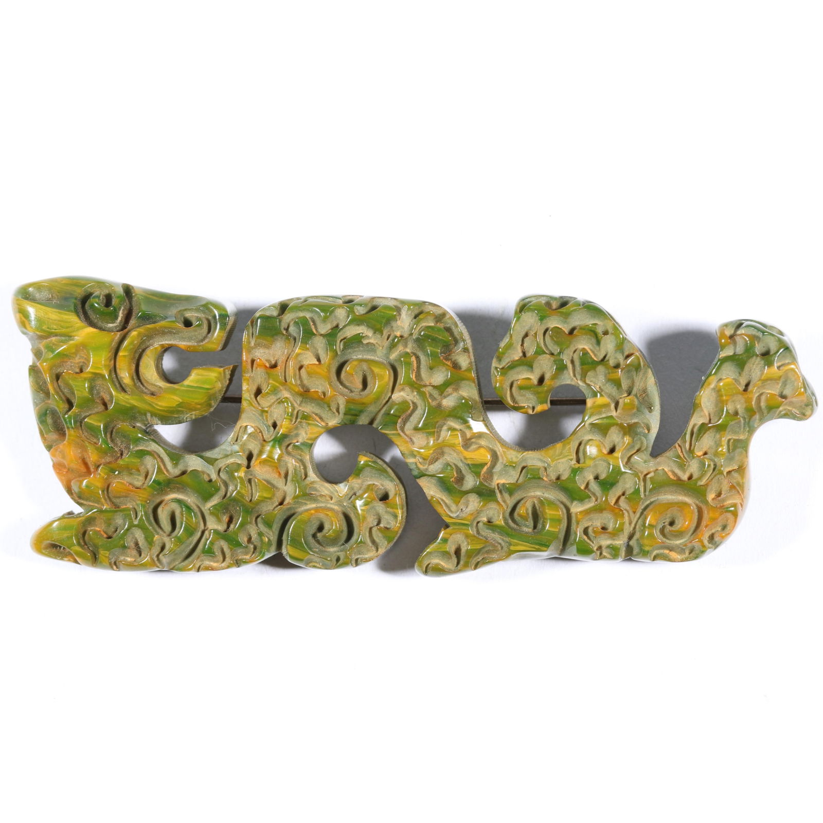 Marbled spinach green and yellow Bakelite sea monster deeply carved brooch. 3 7/8'Lx 1 1/4'W (1 of 5)
