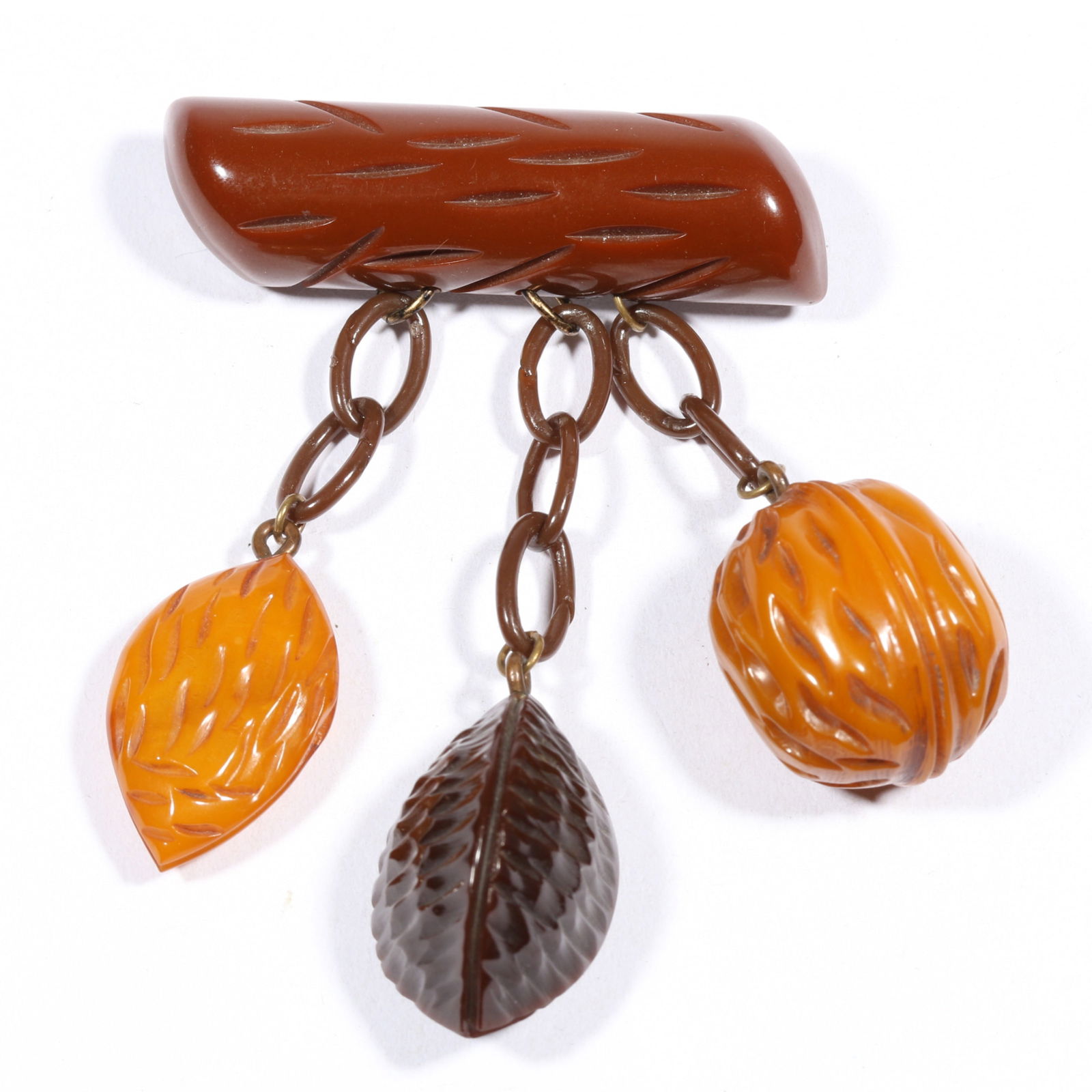 Vintage Bakelite drop brooch with almond, Brazil nut and walnut charms. 3 1/4'Drop x 2 1/8'W: Vintage Bakelite drop brooch with almond, Brazil nut and walnut charms. 3 1/4"Drop x 2 1/8"W