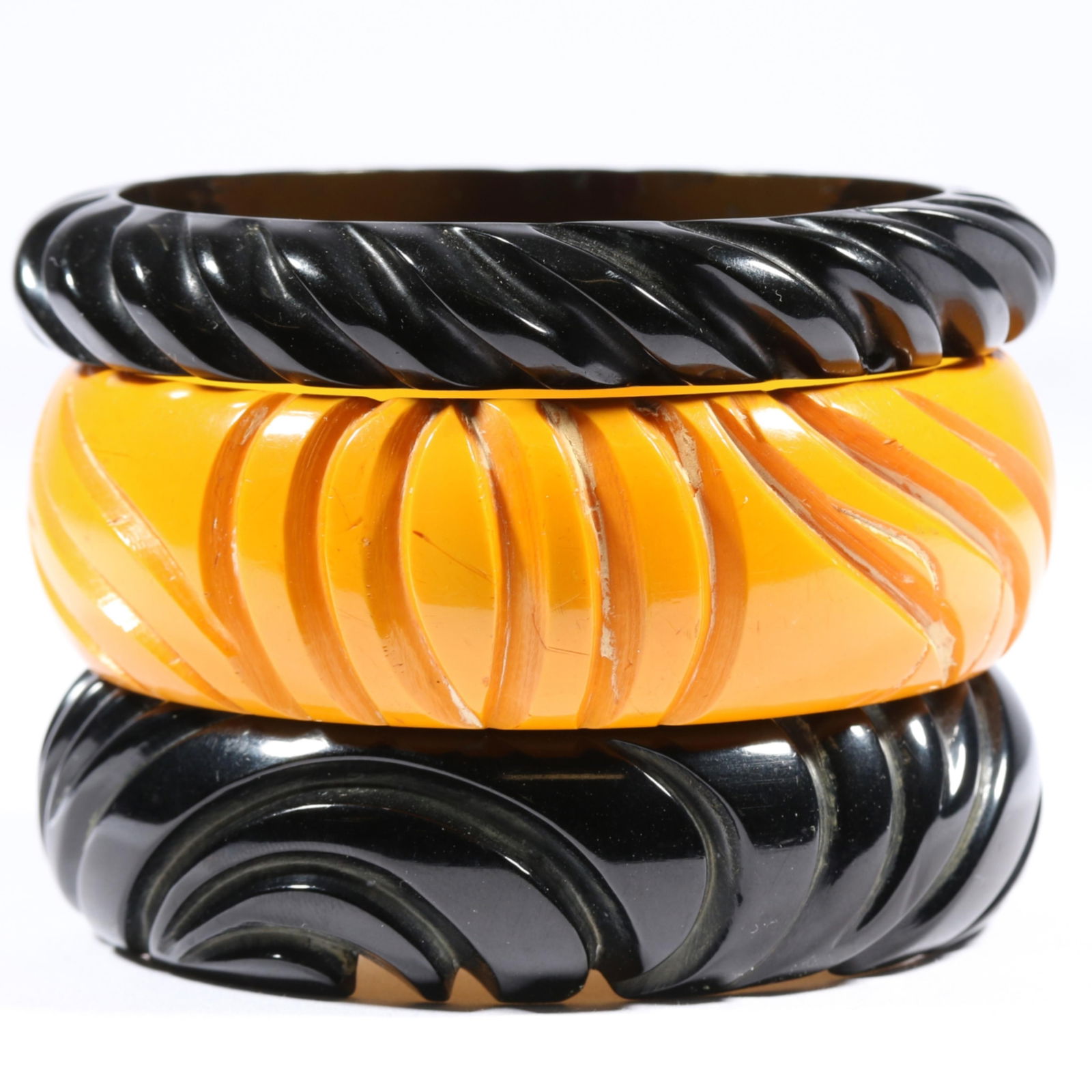 Vintage deeply carved Bakelite bangle bracelet stack. 1'H x 2 1/2'Inner Diameter (yellow bangle) (1 of 5)