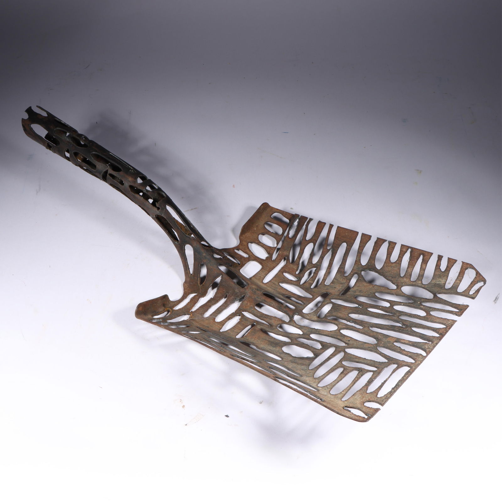 Denice Bizot (American, 20th/21st century), "Shovelesque," pierced metal shovel blade found object (1 of 17)