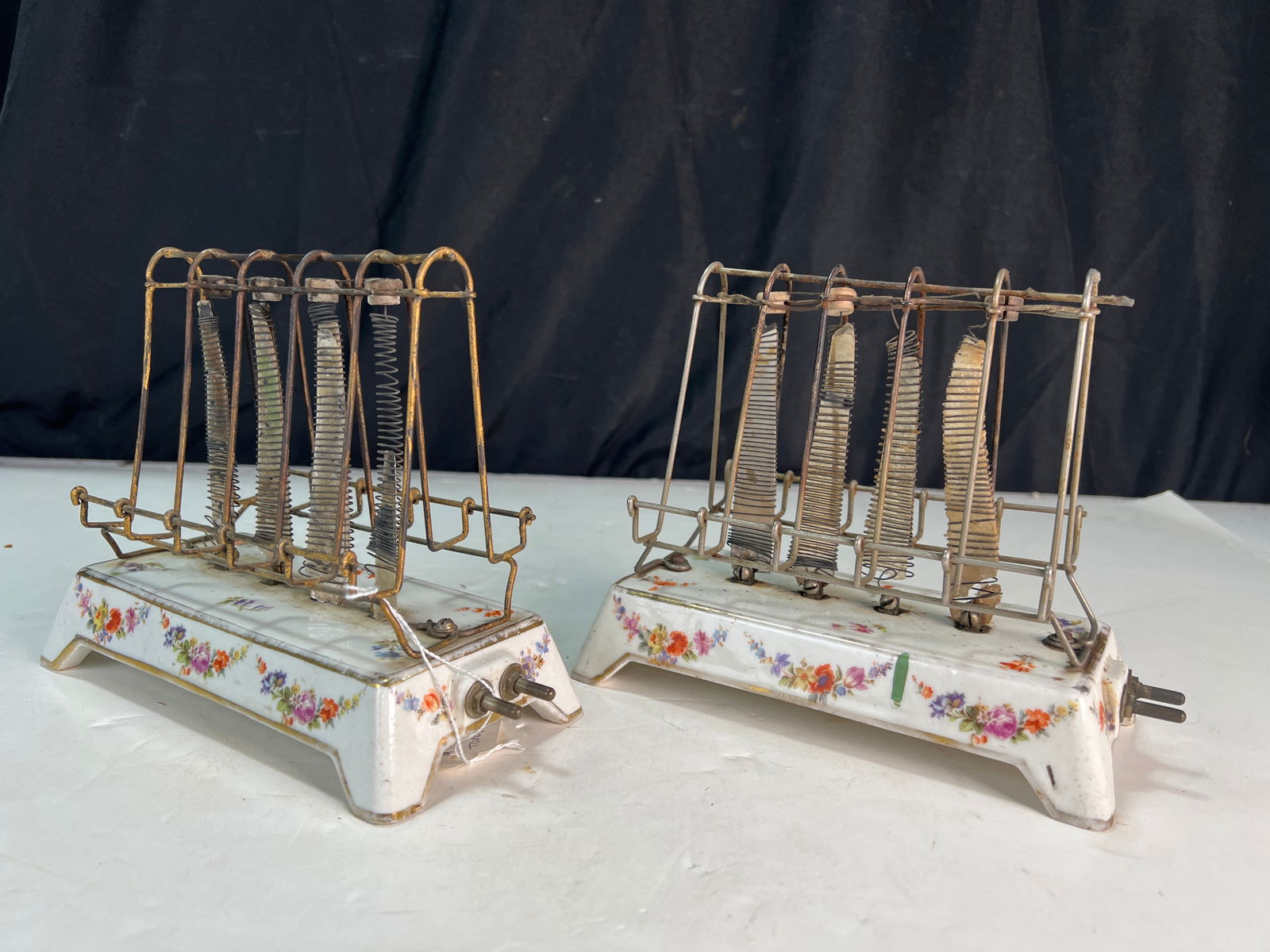 Two General Electric Model D-12 toasters, circa 1908, floral porcelain base: Two General Electric Model D-12 toasters, circa 1908, floral porcelain base,