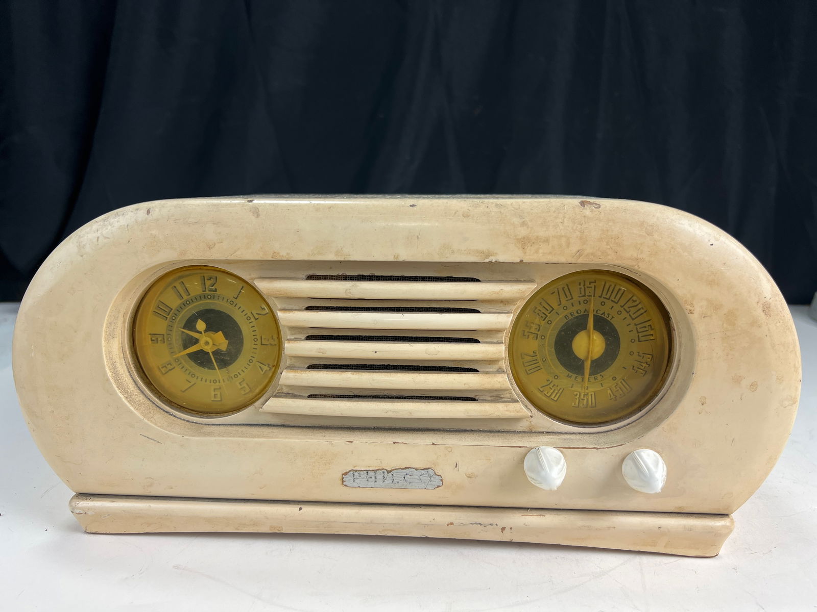 Philco Model 42-KR5 clock radio,1942, designed to sit on top of a Philco refrigerator, with a curved: Philco Model 42-KR5 clock radio,1942, designed to sit on top of a Philco refrigerator, with a curved bottom to fit the contour of the fridge's top, for restoration