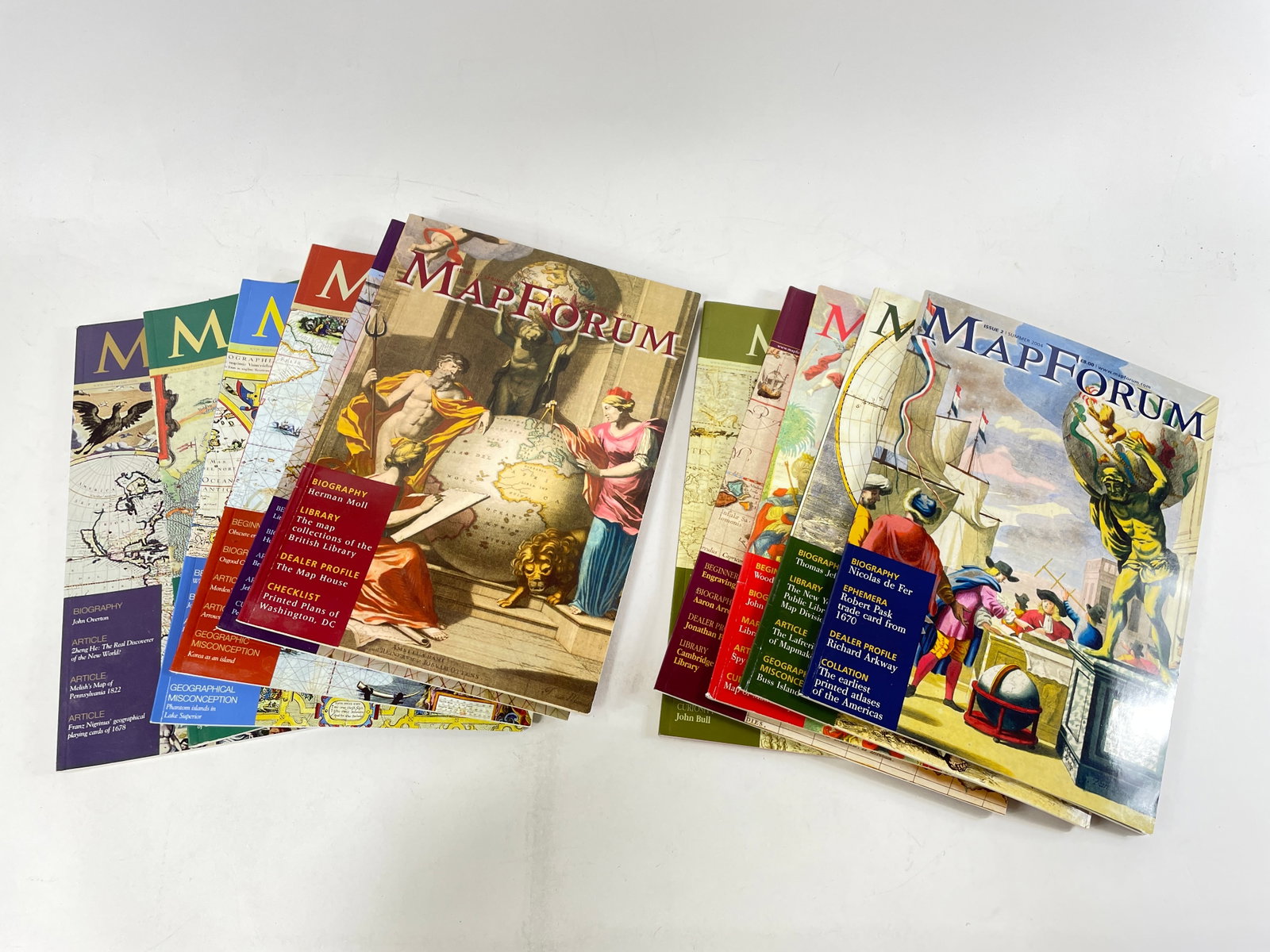Group of MapForum Magazines: Group of MapForum Magazines A collection of 11 MapForum magazines featuring various articles and biographies related to cartography and map collecting.