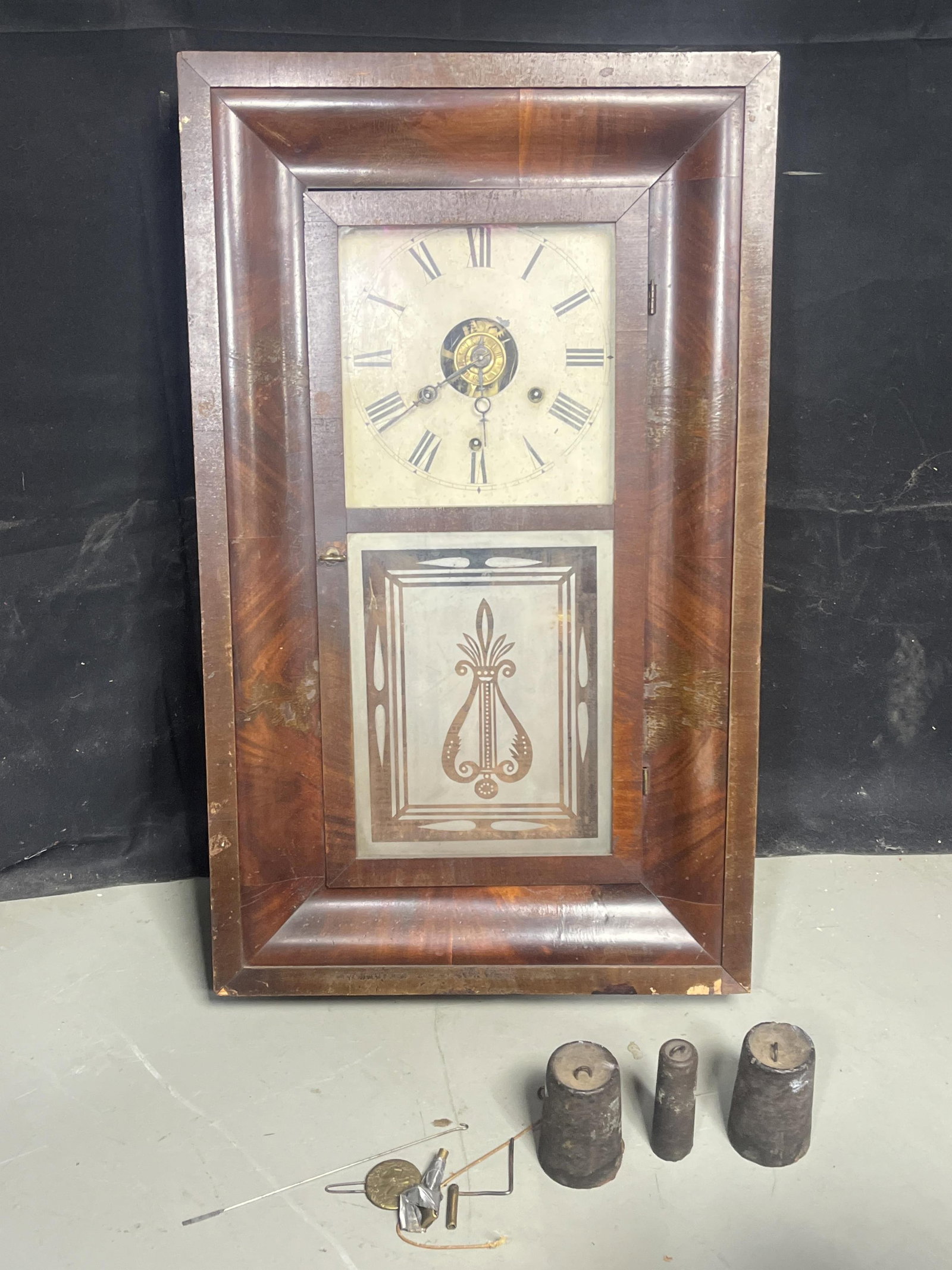 Unidentified Wall clock with frosted glass design: Unidentified Wall clock with frosted glass design Comes with weights and key made by Adkins and Porter, has wear, scuffs and peeling 26.5" H X 16" W X 4.5" D